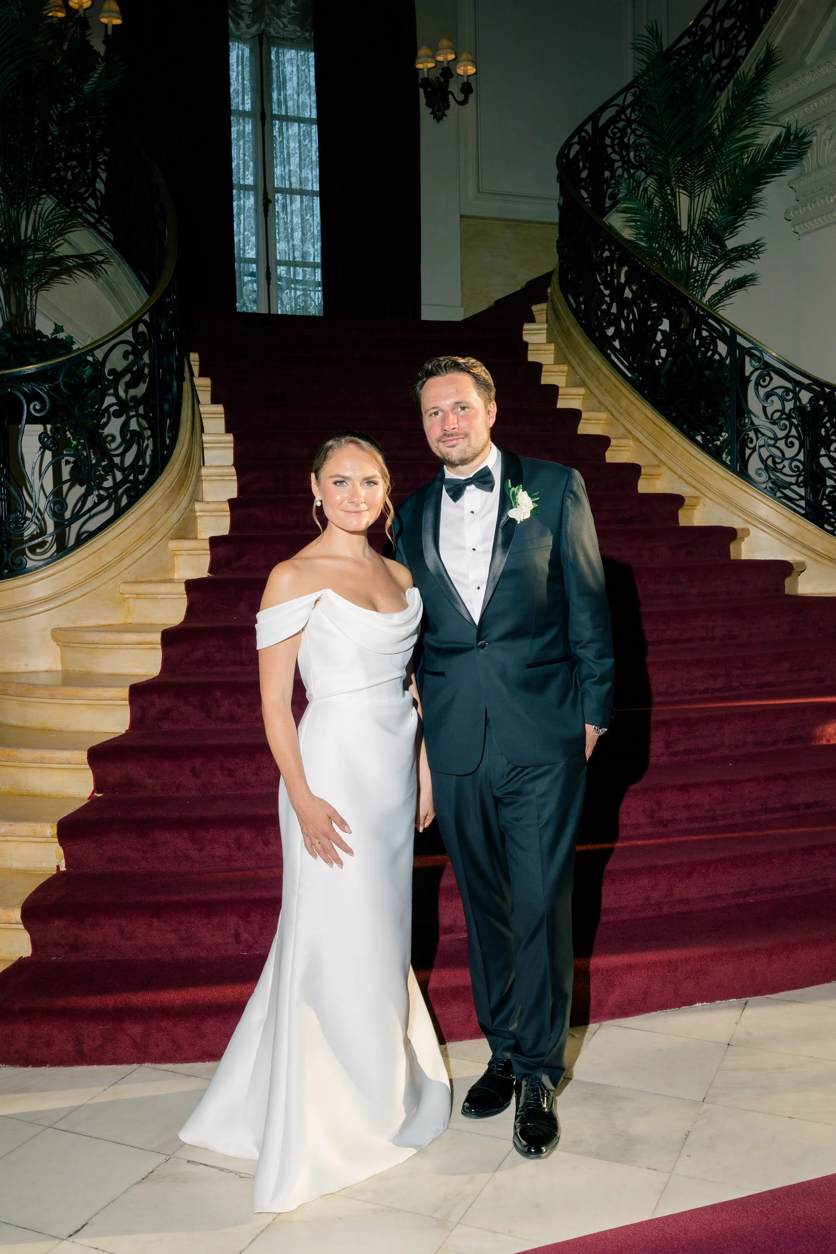 Elegant staircase portraits at a Rosecliff wedding
