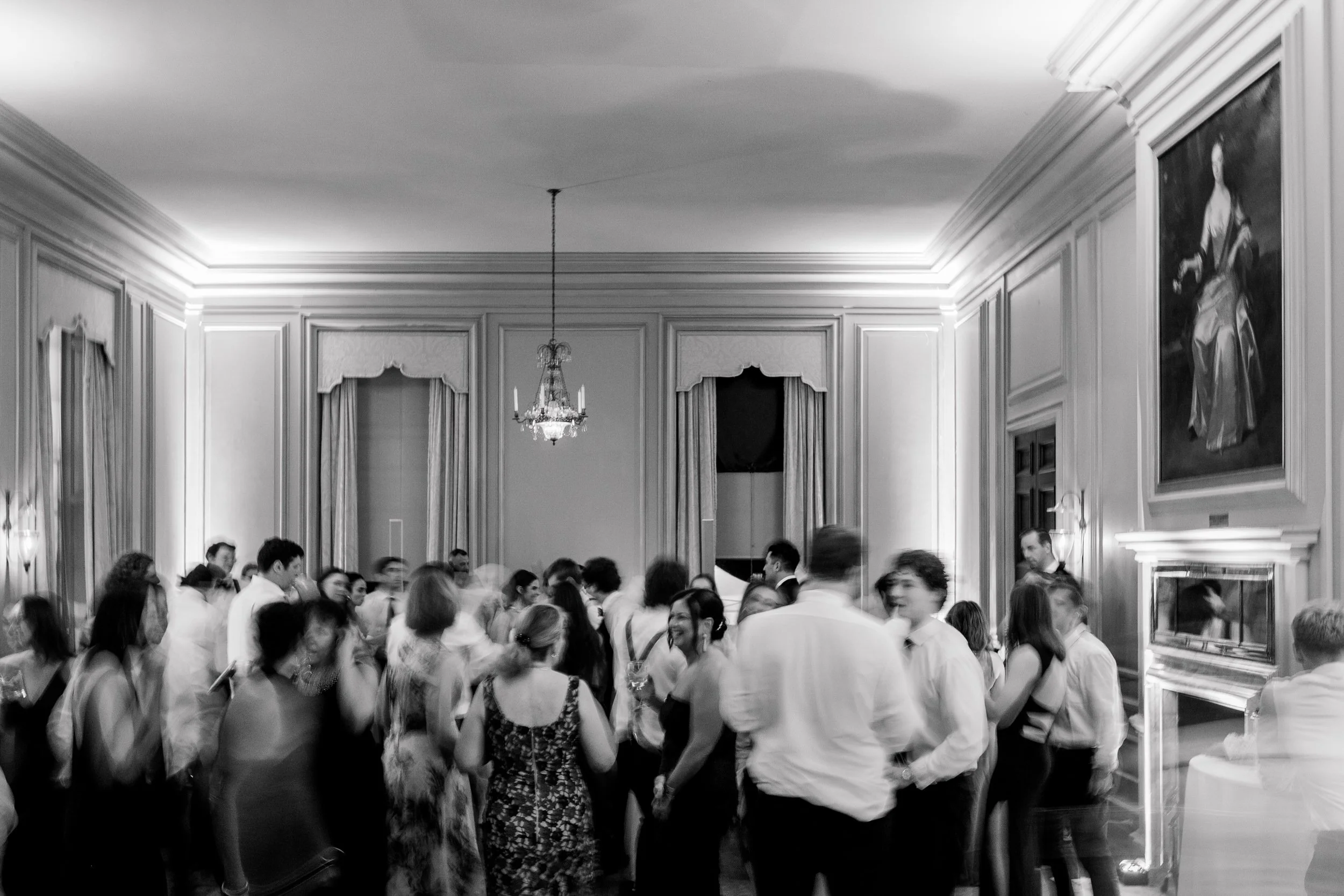 Bride and groom surrounded by friends and family while dancing at their Ipswich Massachusetts wedding reception.