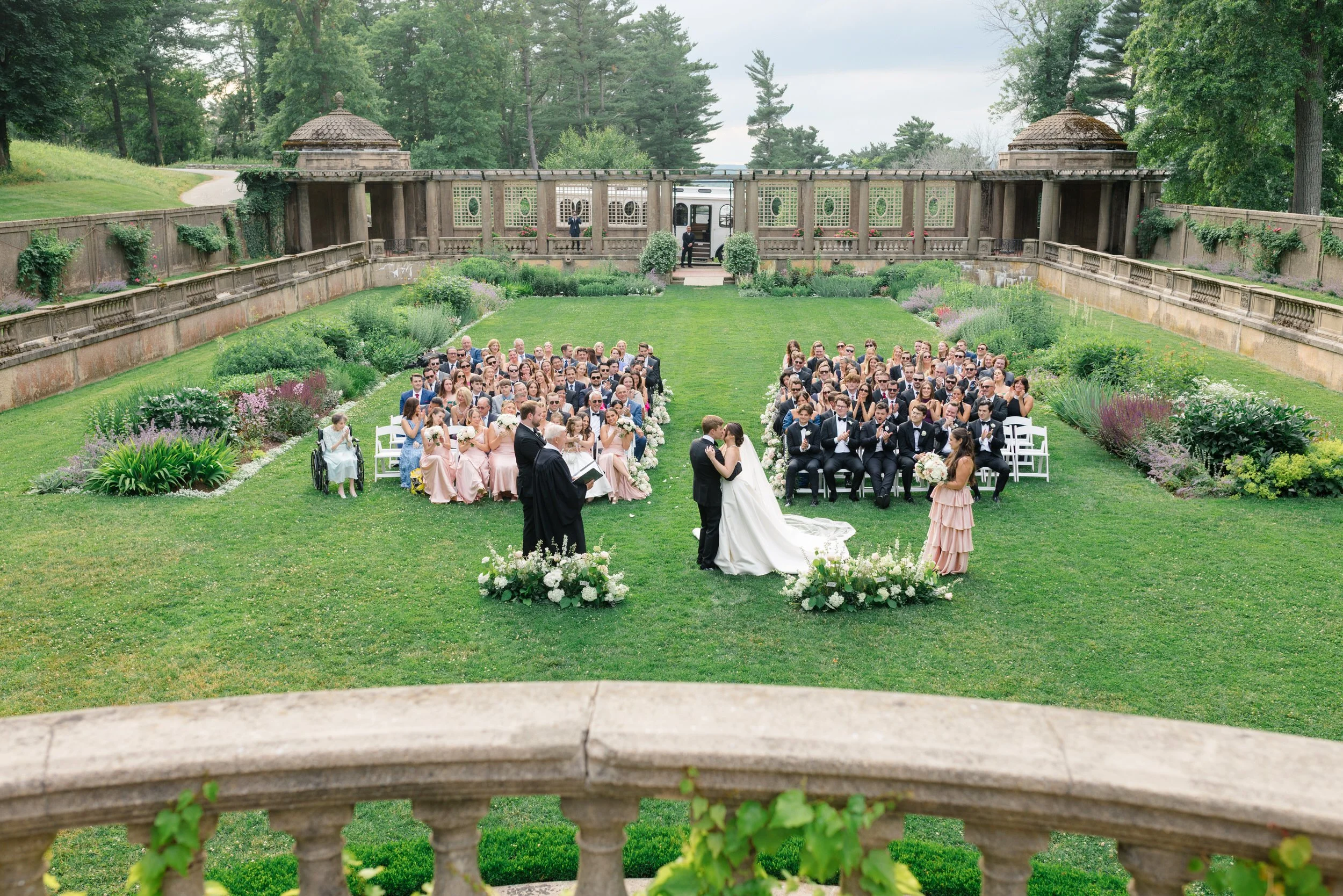 Romantic garden wedding ceremony at Castle Hill on the Crane Estate in soft natural light.