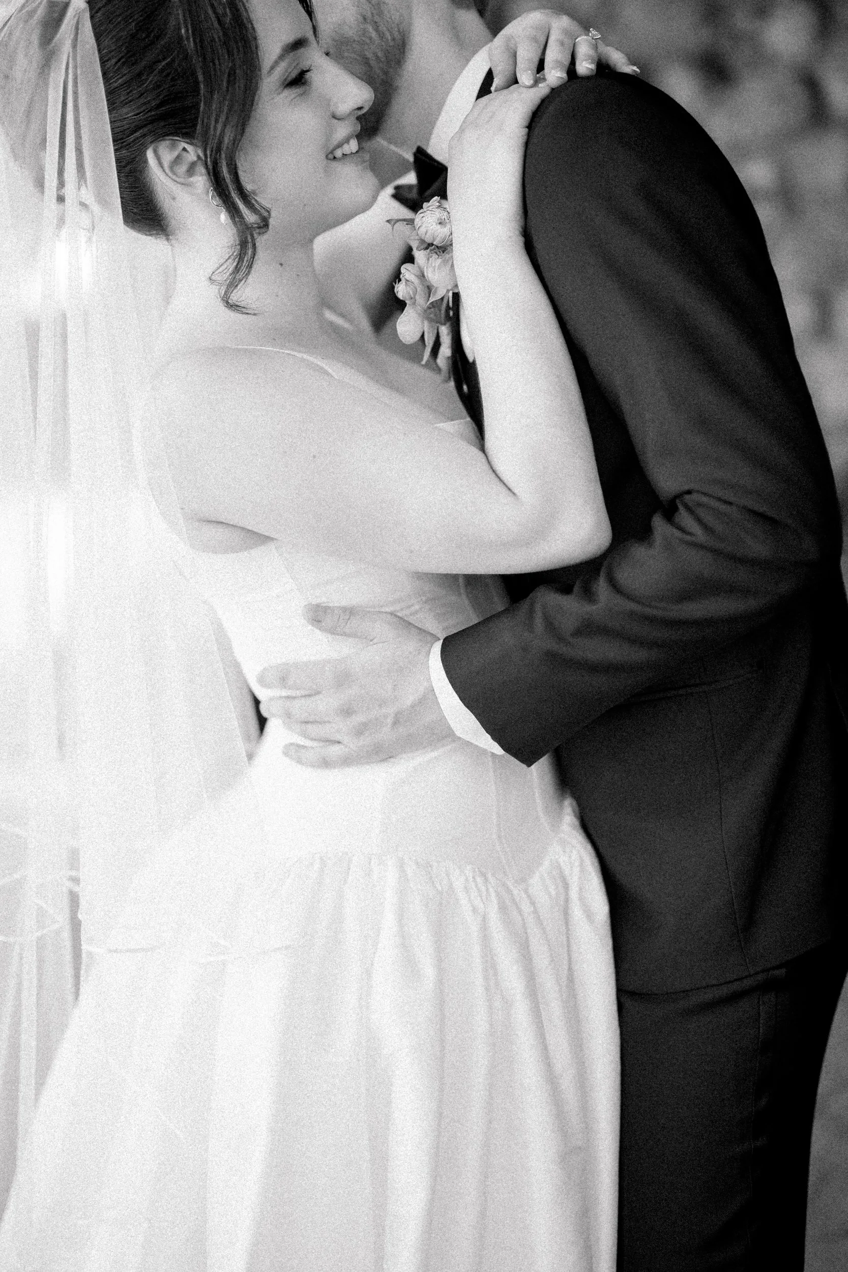 Editorial wedding portraits of bride in basque waist gown and groom in black suit at estate venue