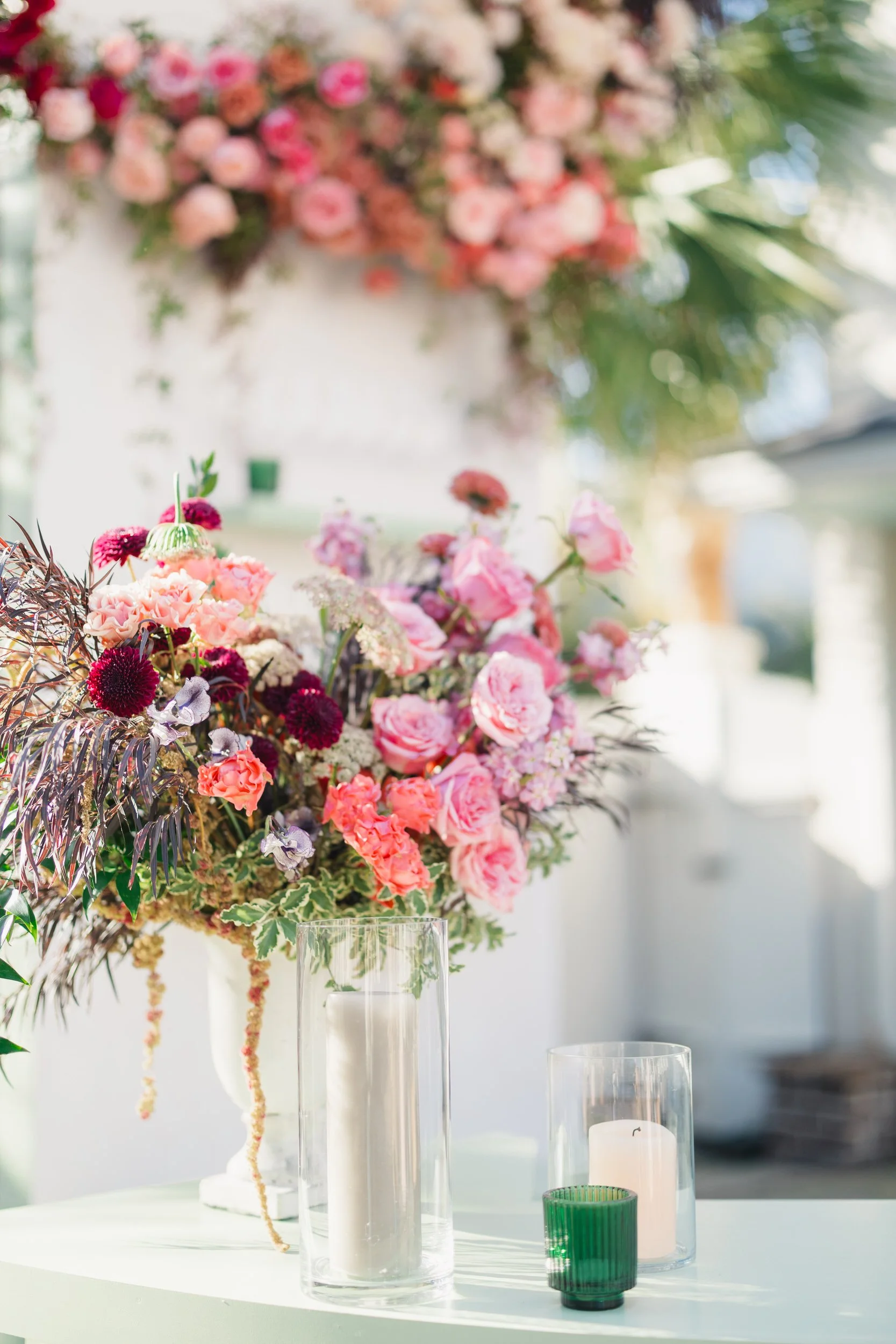 Vibrant cocktail hour scene featuring a green bar and fashionable wedding guests in Charleston.