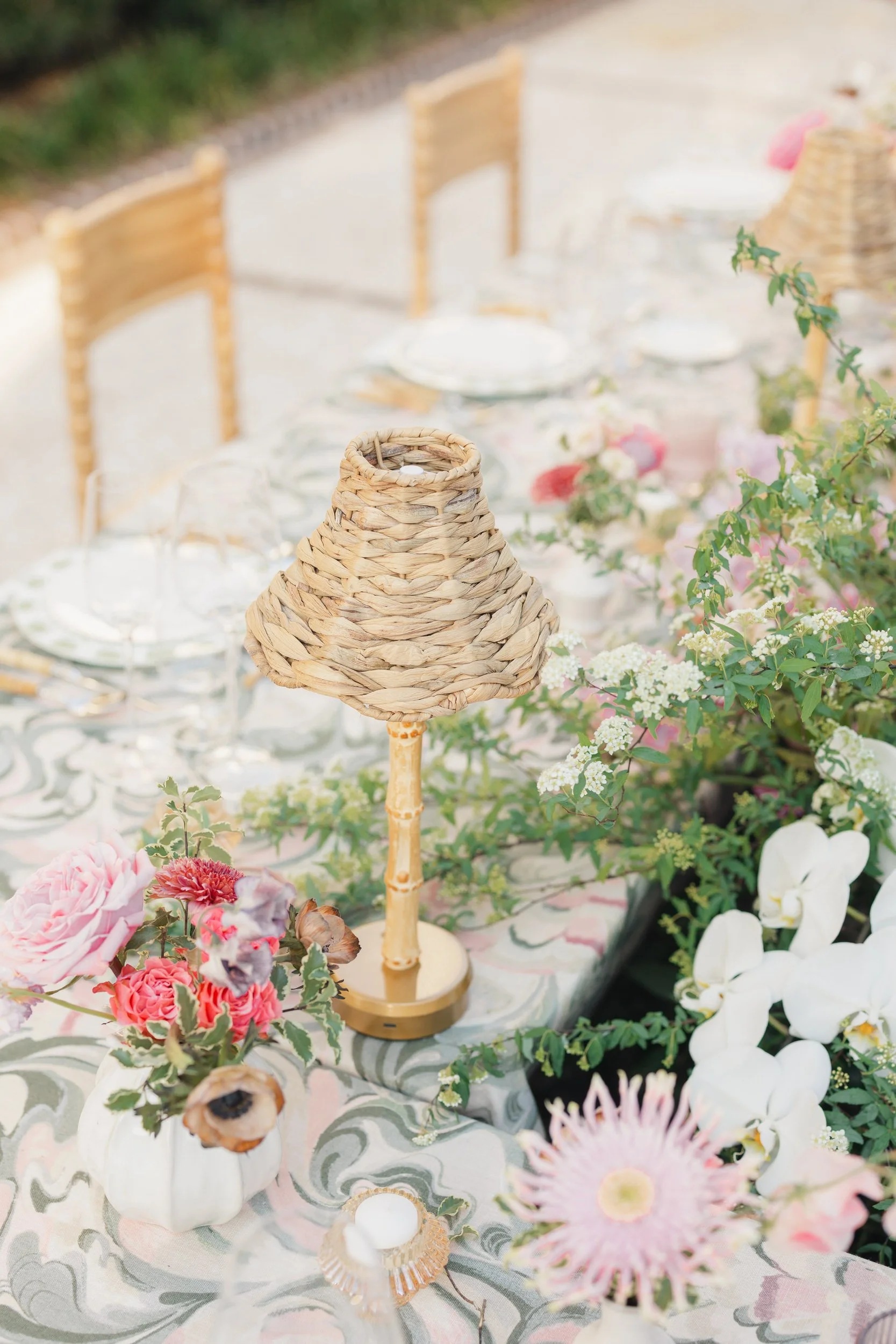 Garden-inspired wedding reception setup featuring pink and green florals.