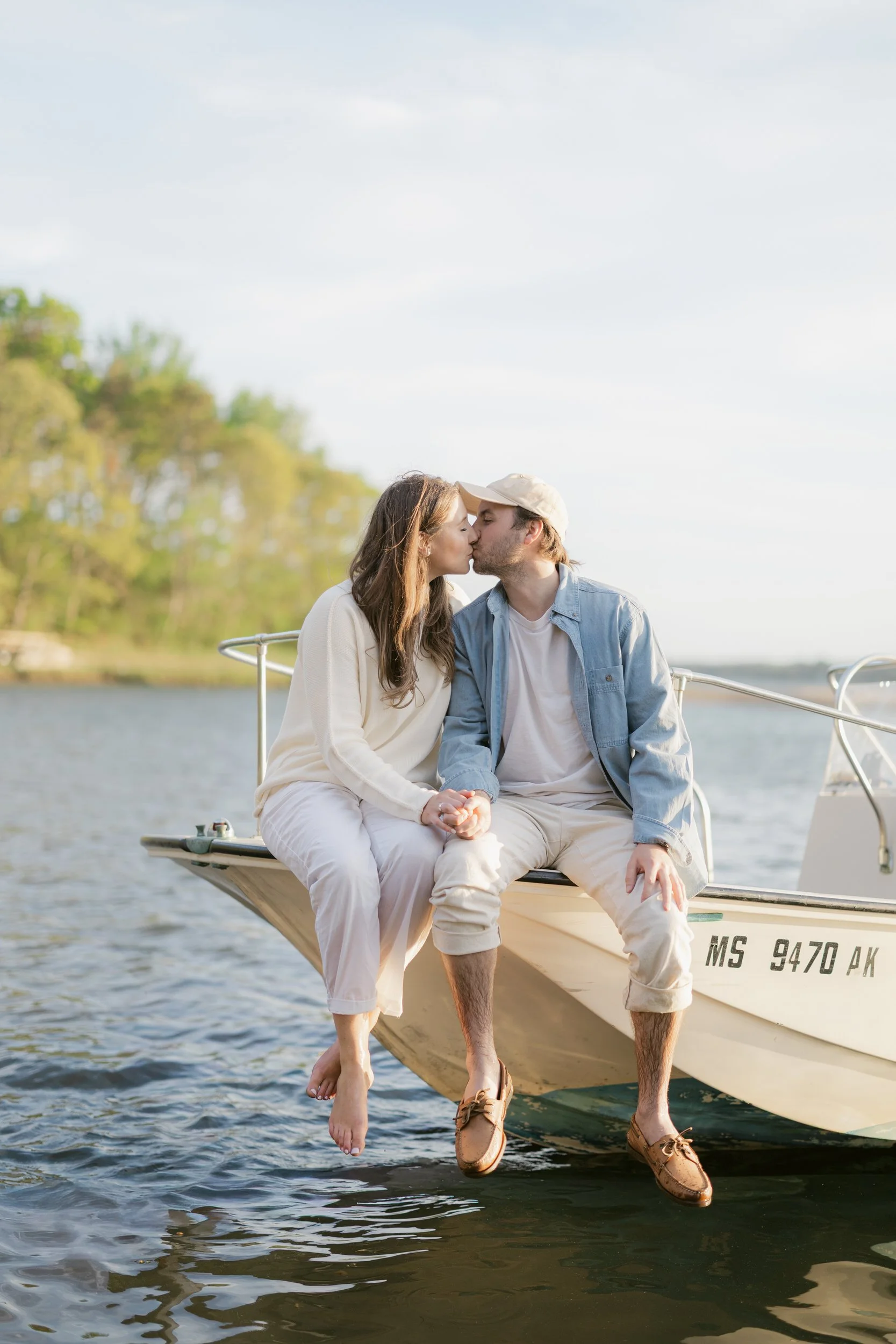 Chatham Cape Cod engagement session with couple on a boat during sunset on Cape Cod.