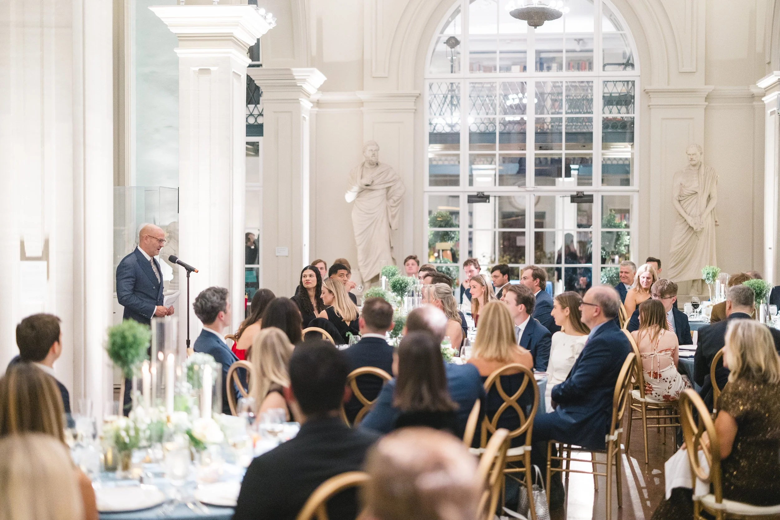 Father of the bride giving a toast during a Boston Athenaeum rehearsal dinner.