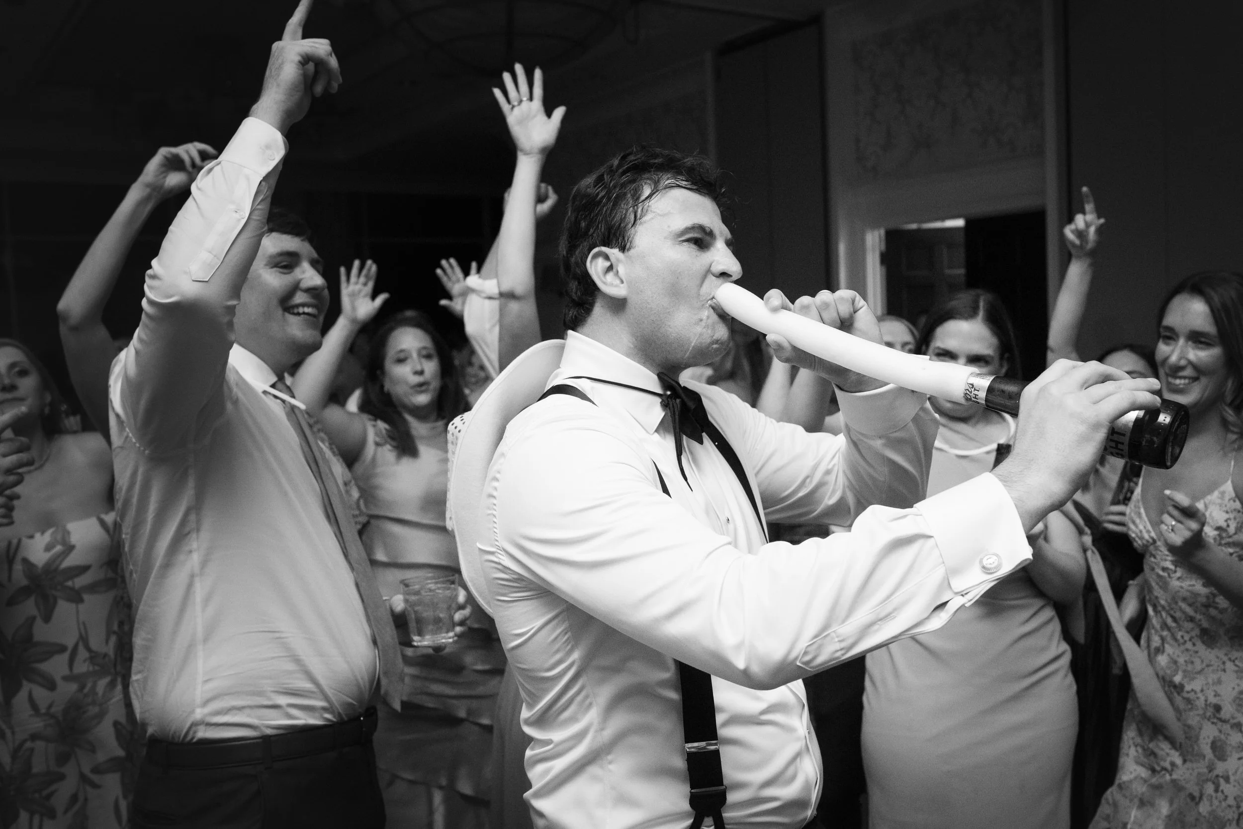 Wedding guests celebrating on the dance floor