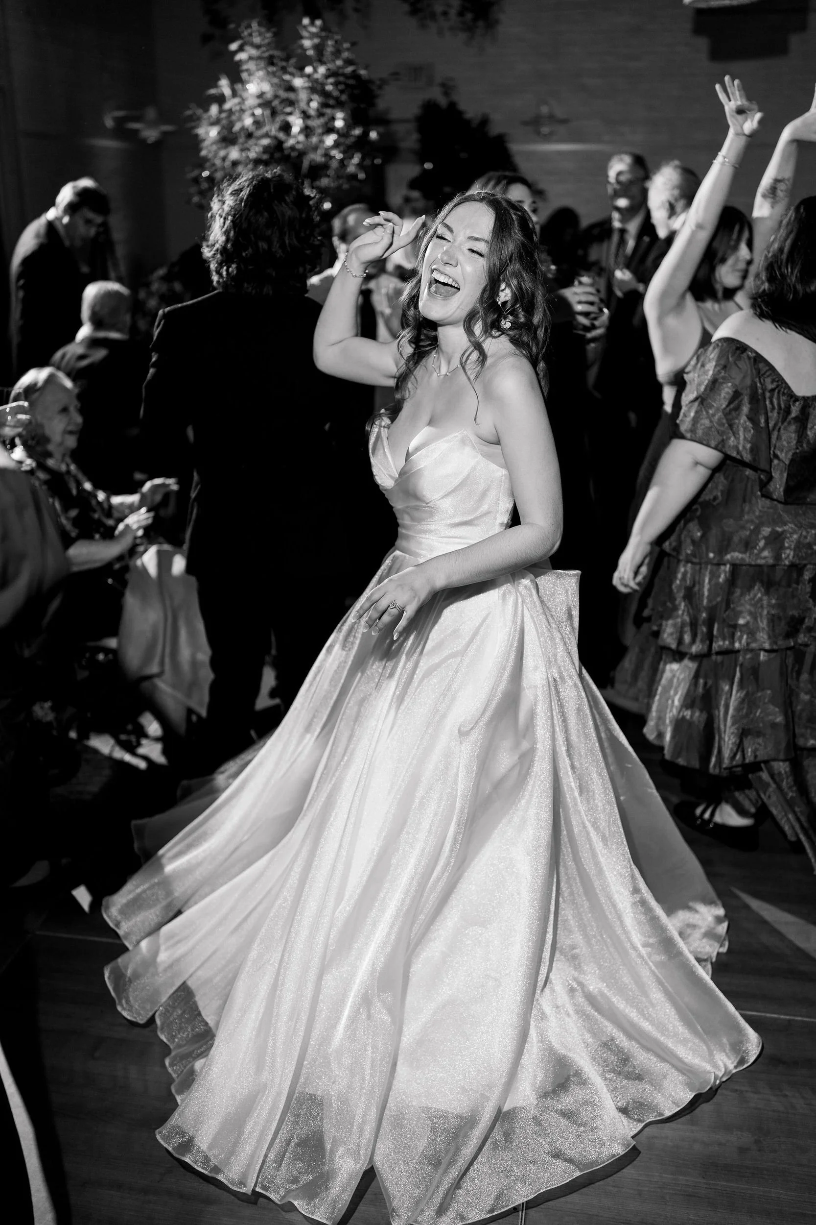 Guests celebrating together on the dance floor at an Elm Bank wedding reception.