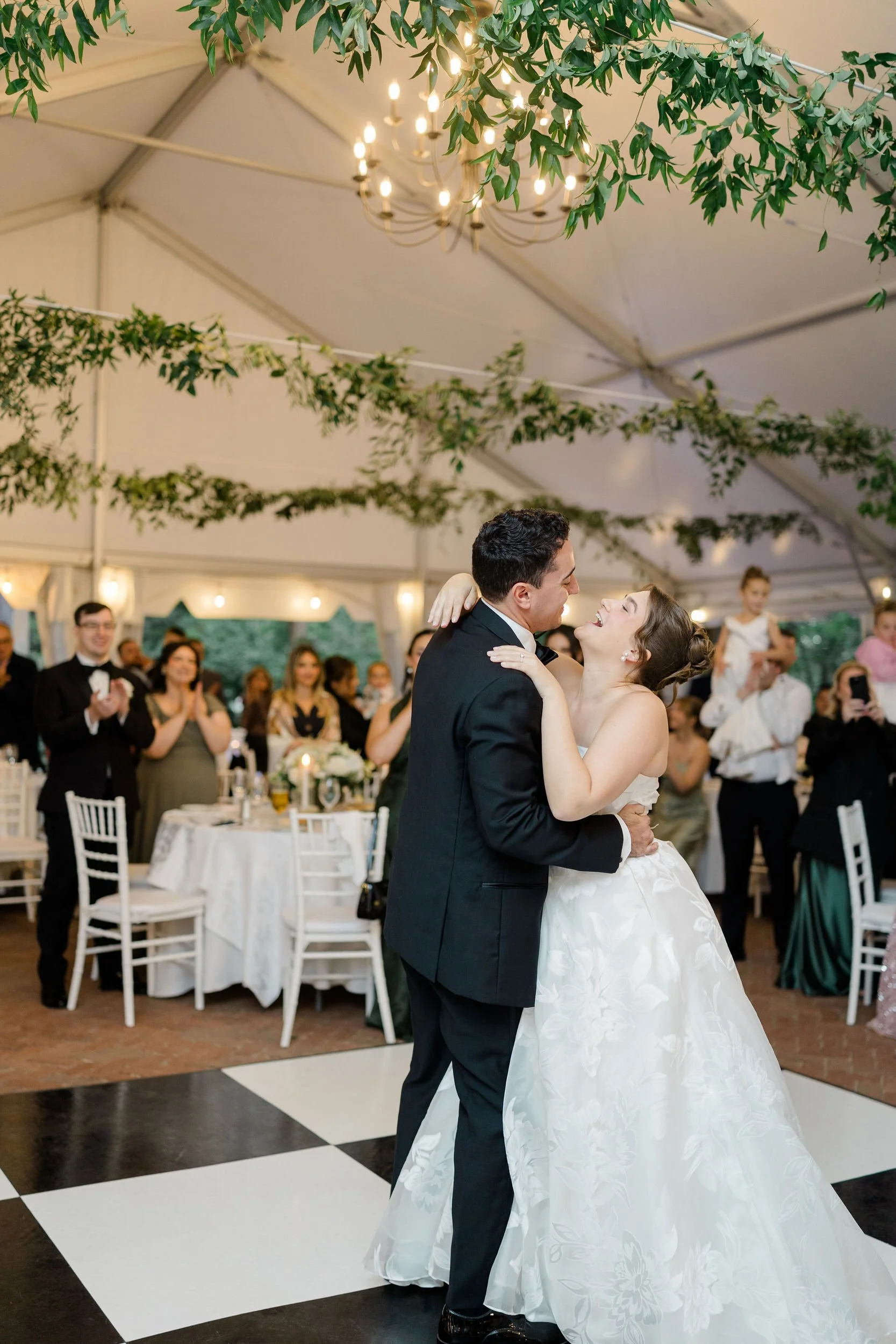 Newlyweds sharing their first dance at the Long Hill estate wedding reception.