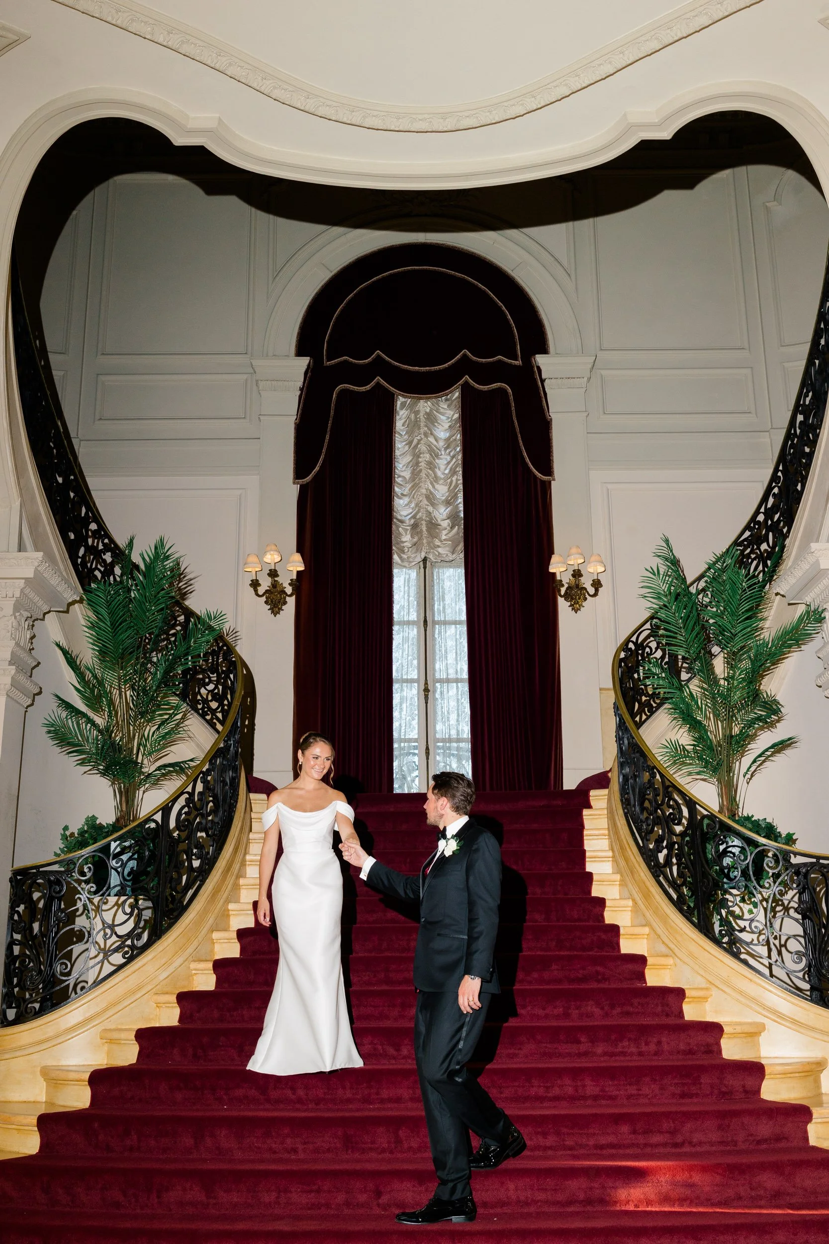 Couple portraits on the iconic heart staircase at Rosecliff Mansion
