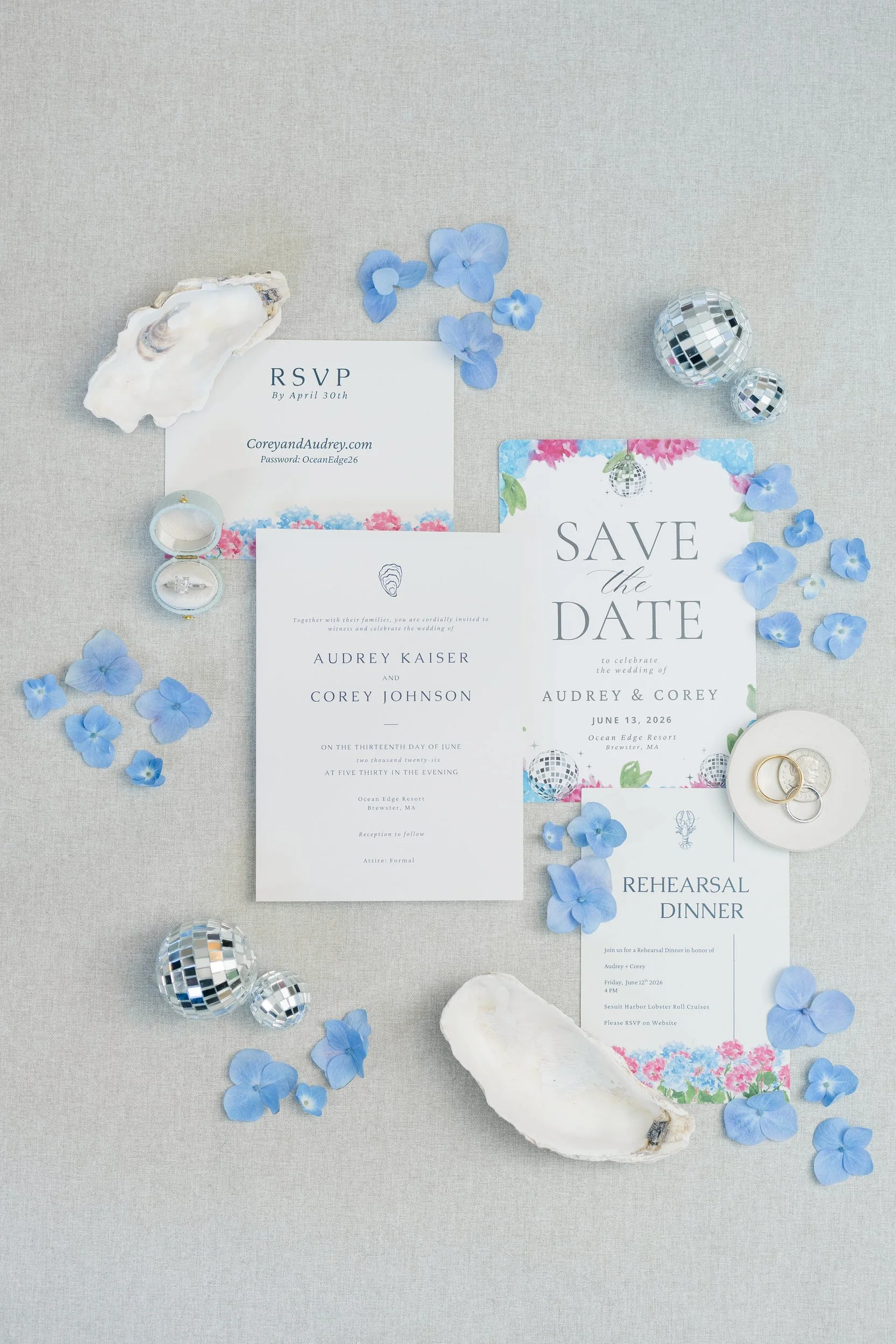 Bridal details including invitation suite, shoes, jewelry, and wedding rings