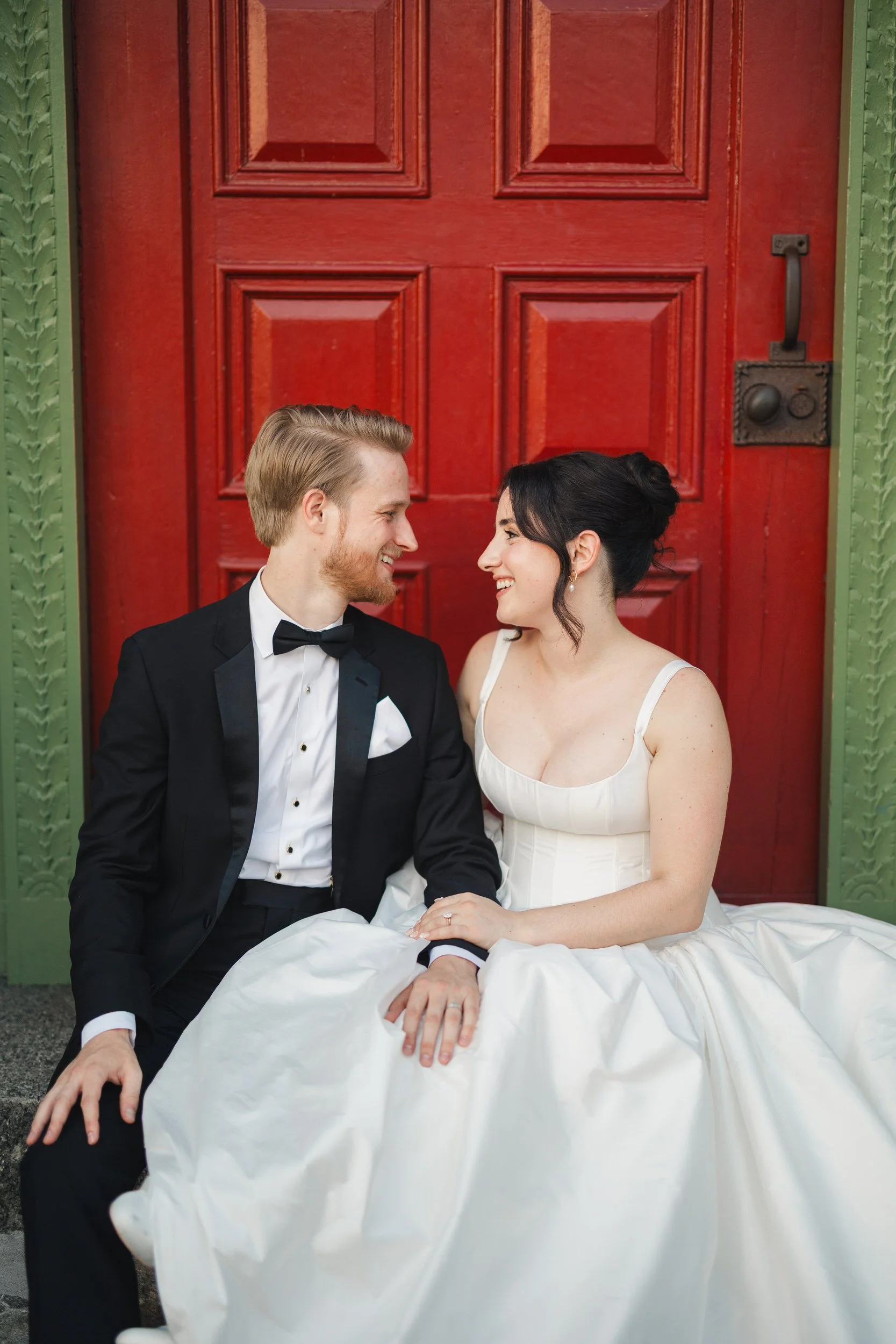 Editorial sunset portraits featuring basque waist gown and black tuxedo at Willowdale Estate