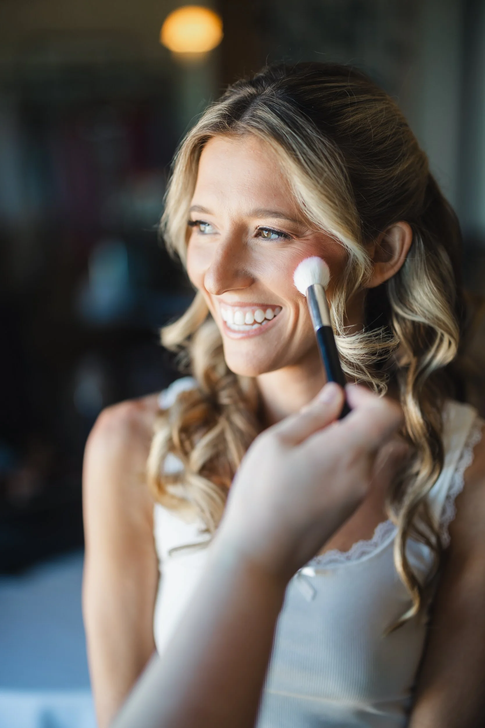 Bride having final touches completed before her Cape Cod wedding