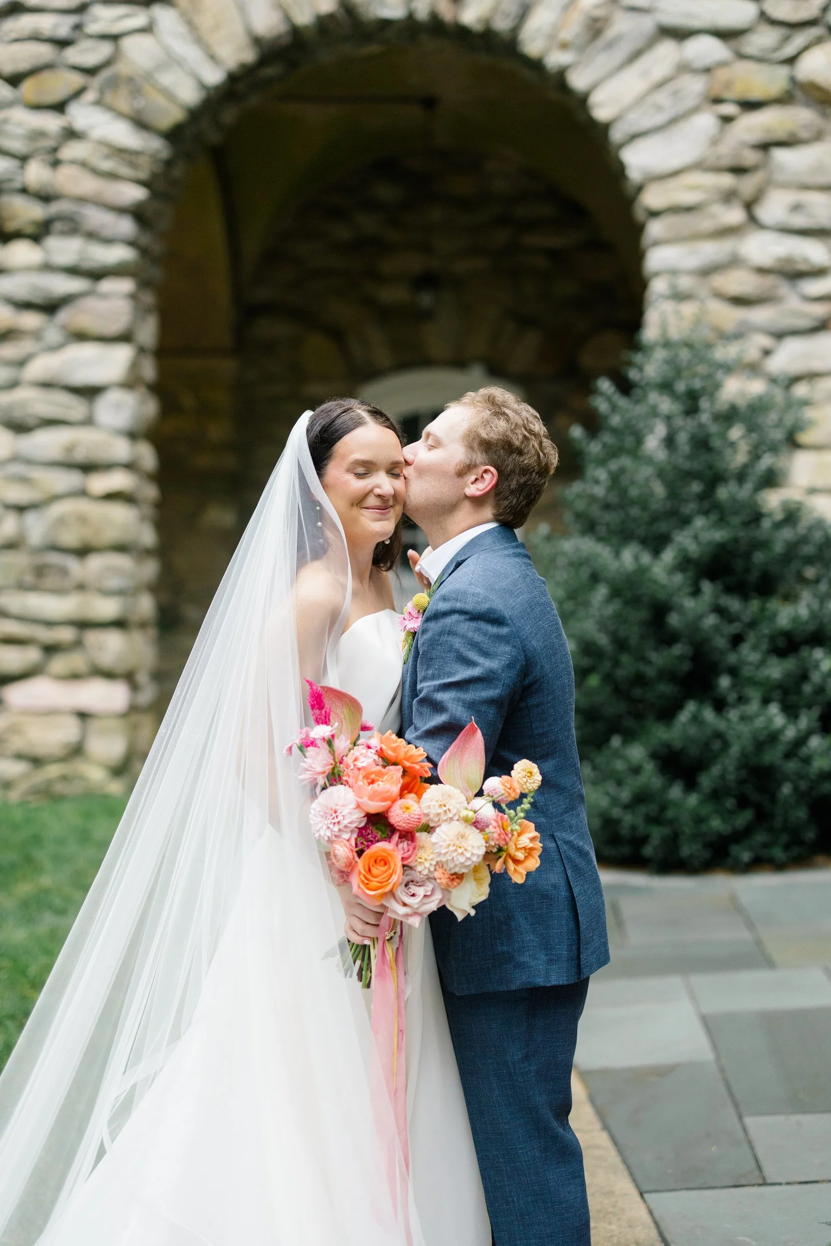 Whimsical bride and groom portraits filled with vibrant garden-inspired colors.