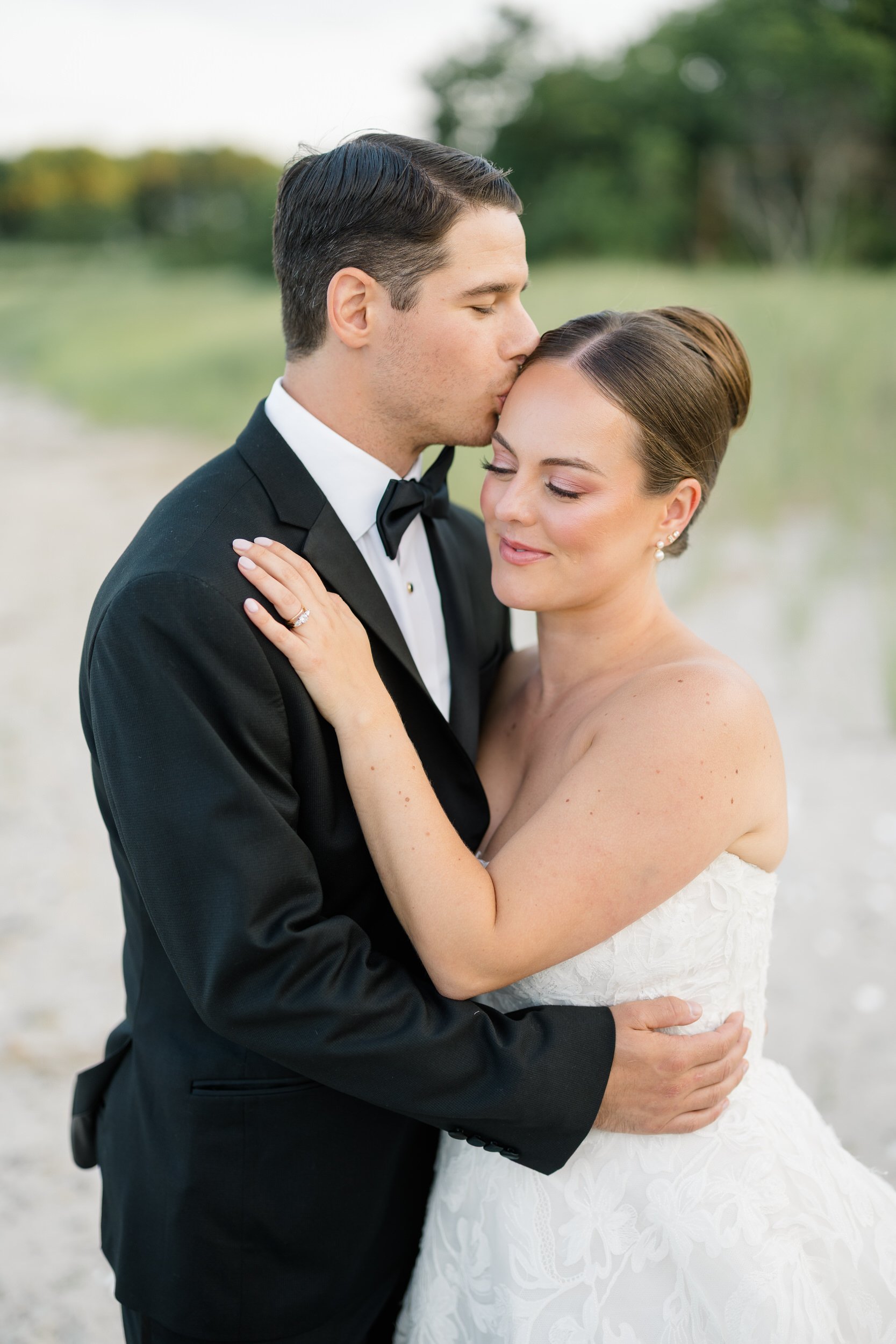 Romantic coastal sunset portraits after the wedding ceremony.