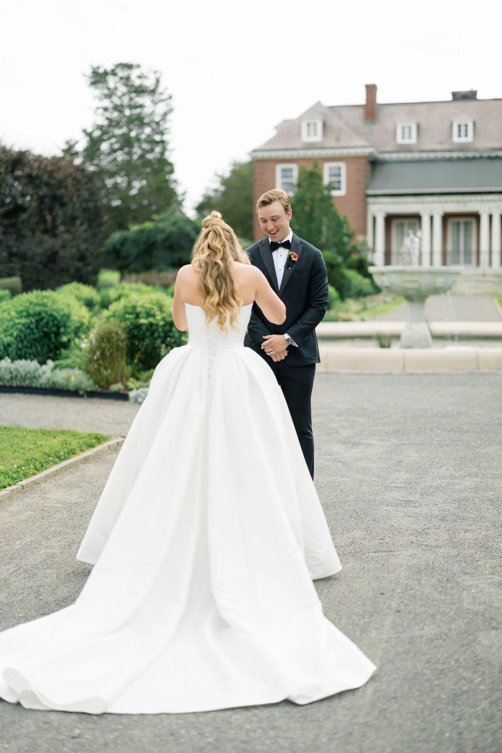 Romantic first look during a garden wedding at The Gardens at Elm Bank