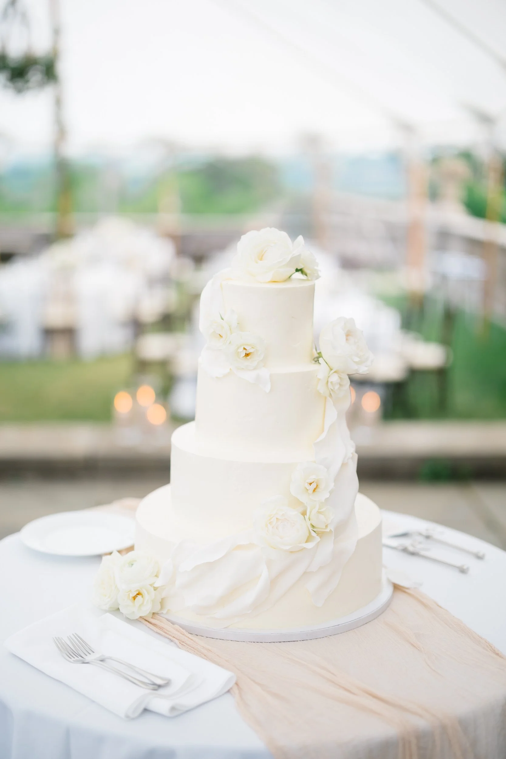 Wedding cake details styled for a romantic evening reception at Crane Estate in Ipswich.