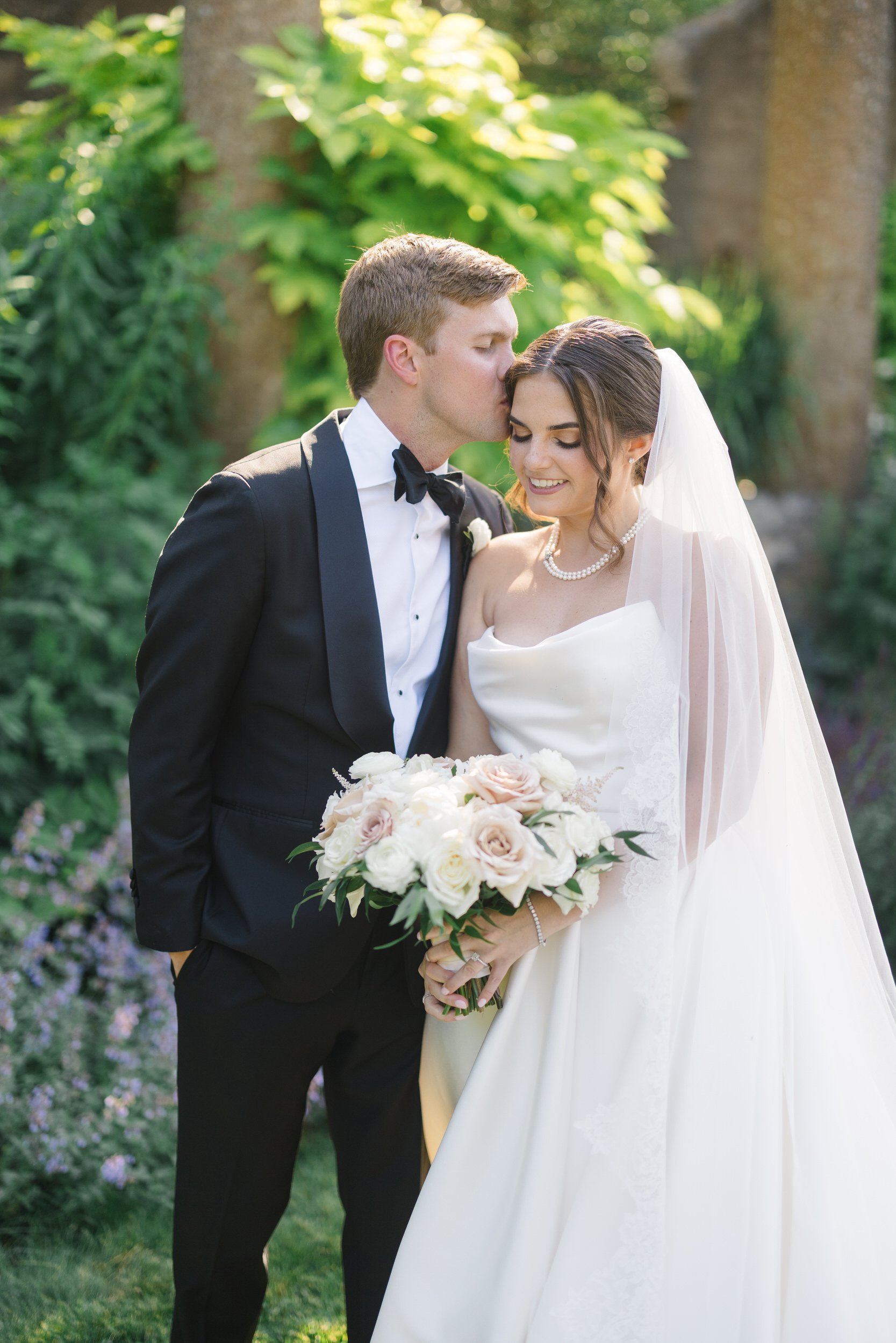 Timeless editorial portraits of the couple exploring the gardens at Castle Hill on the Crane Estate.