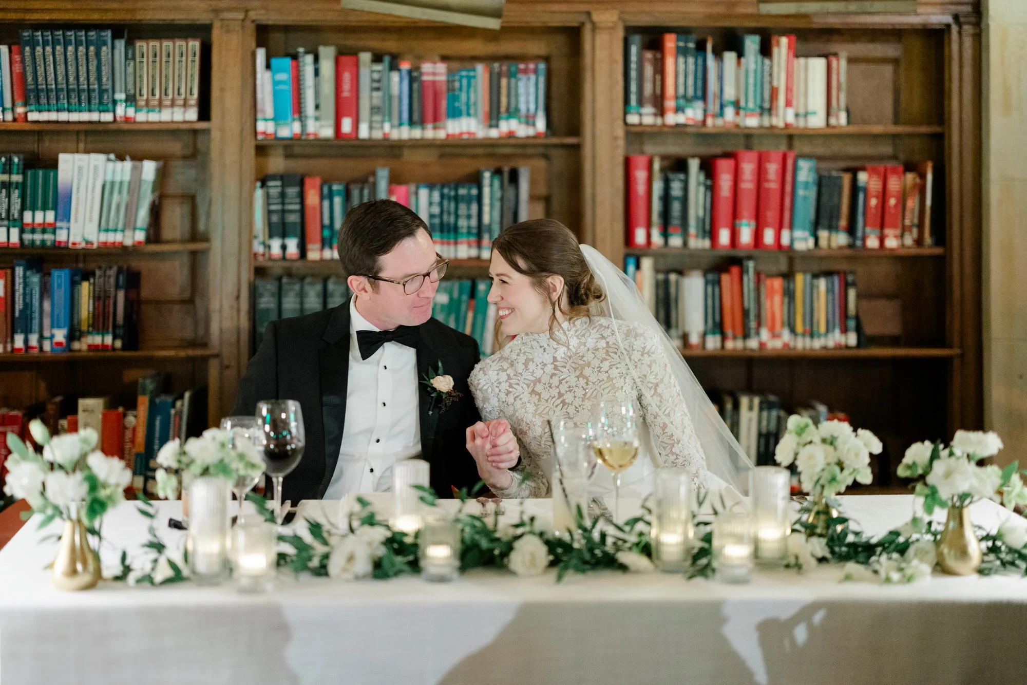 Couple smile together during reception at Boston Public Library Wedding