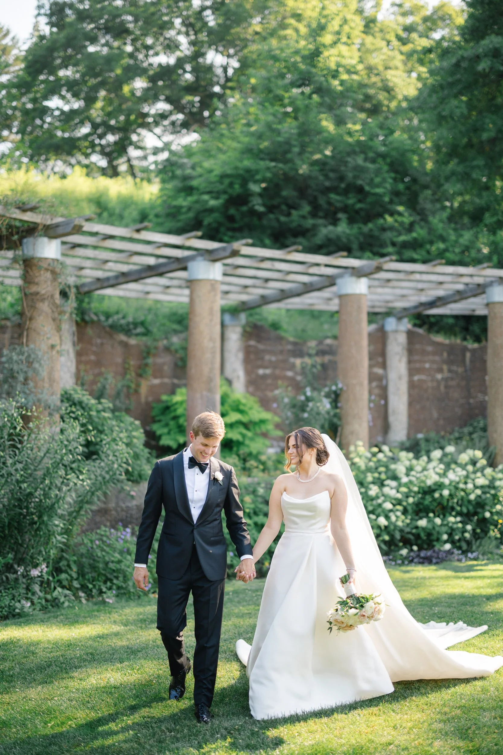 Soft natural light first look between the couple at Crane Estate before their garden ceremony.