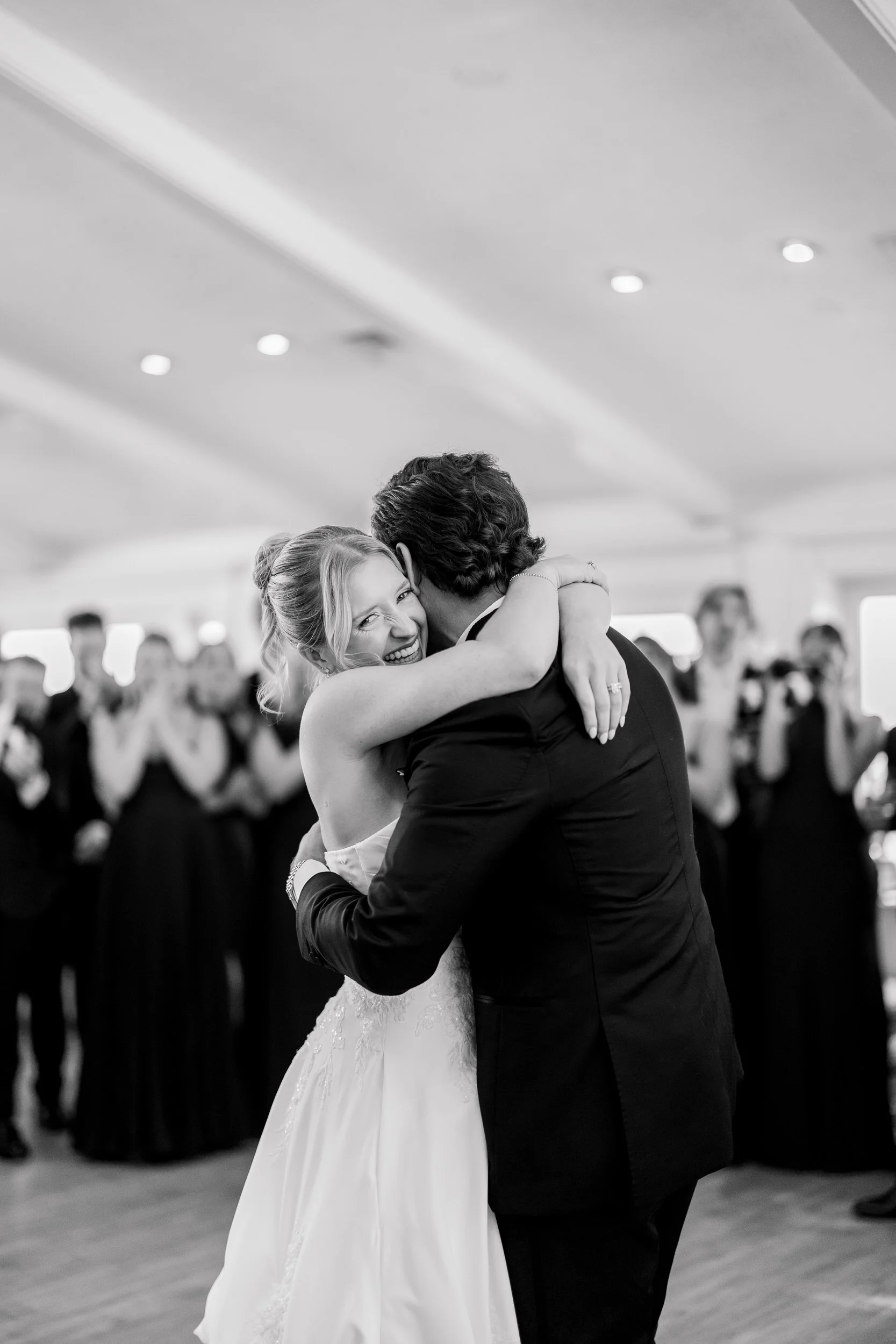 Newlyweds sharing their first dance at Wychmere Beach Club on Cape Cod.