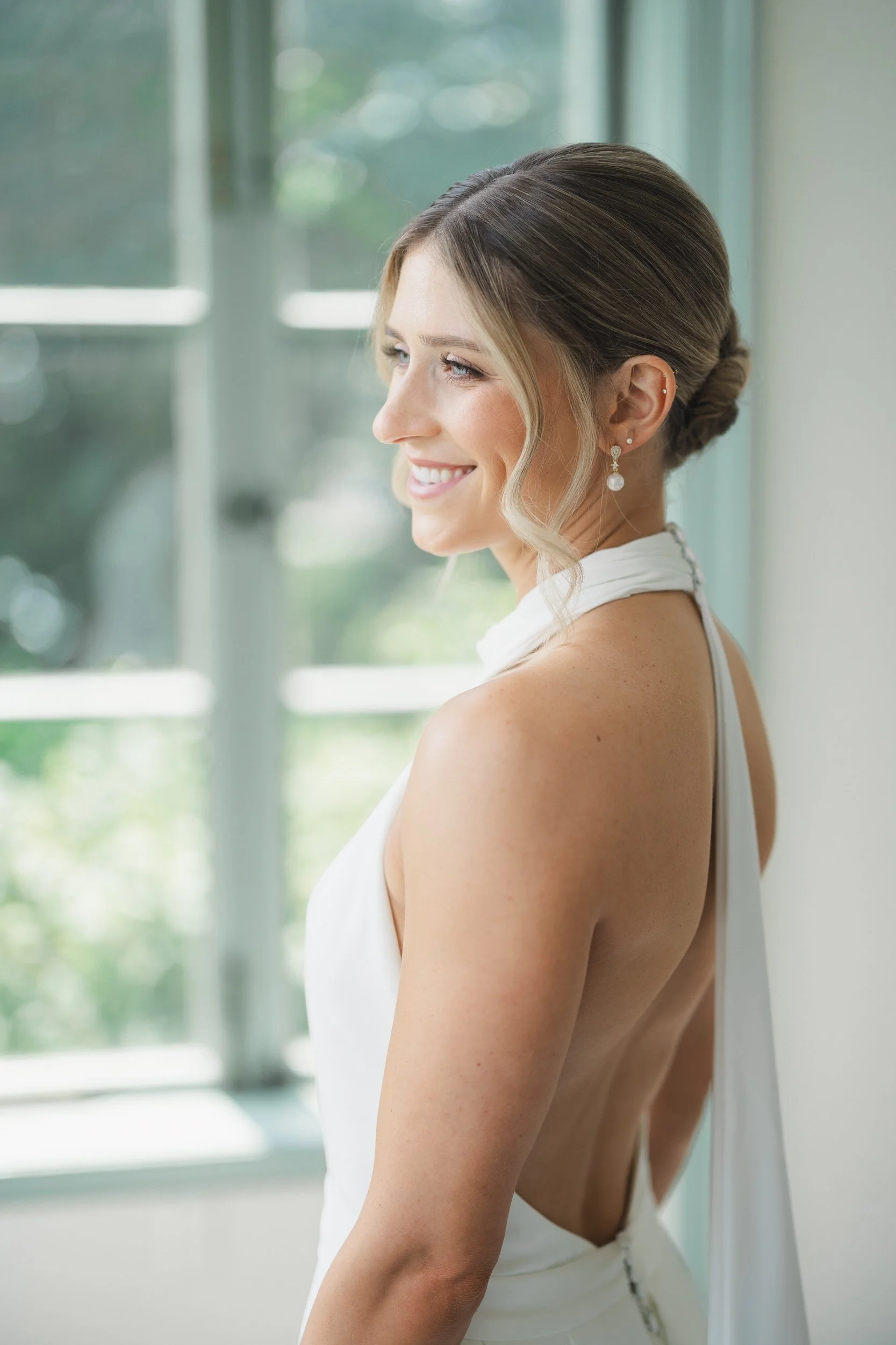 Timeless bridal portraits featuring the bride in natural light with ocean views at Misselwood Estate.