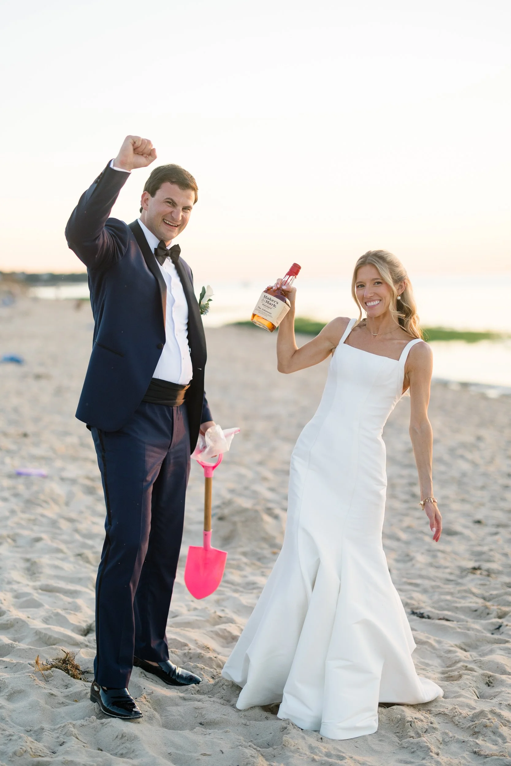 Newlyweds enjoying a whiskey toast during sunset portraits