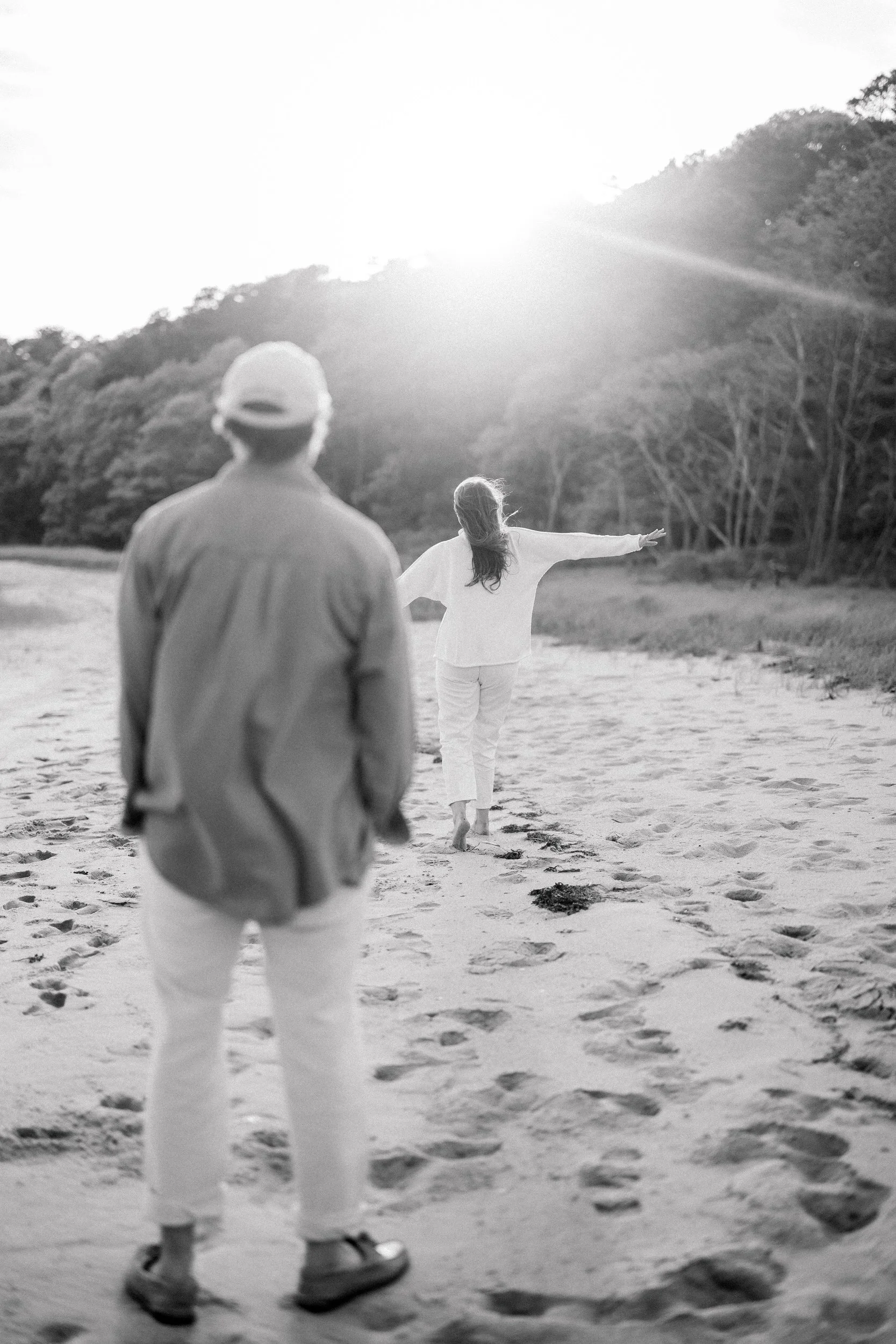 Cape Cod engagement session in Chatham with soft coastal wind and natural dune grass setting.