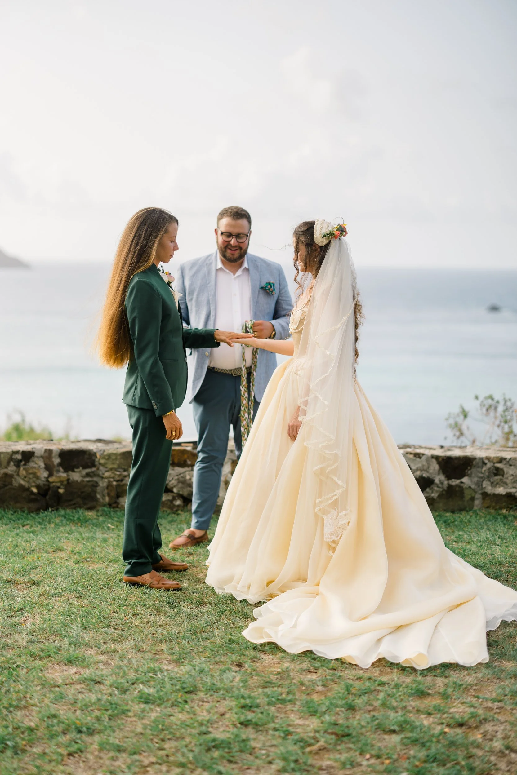 Handfasting ritual during a queer wedding ceremony in St. Thomas.