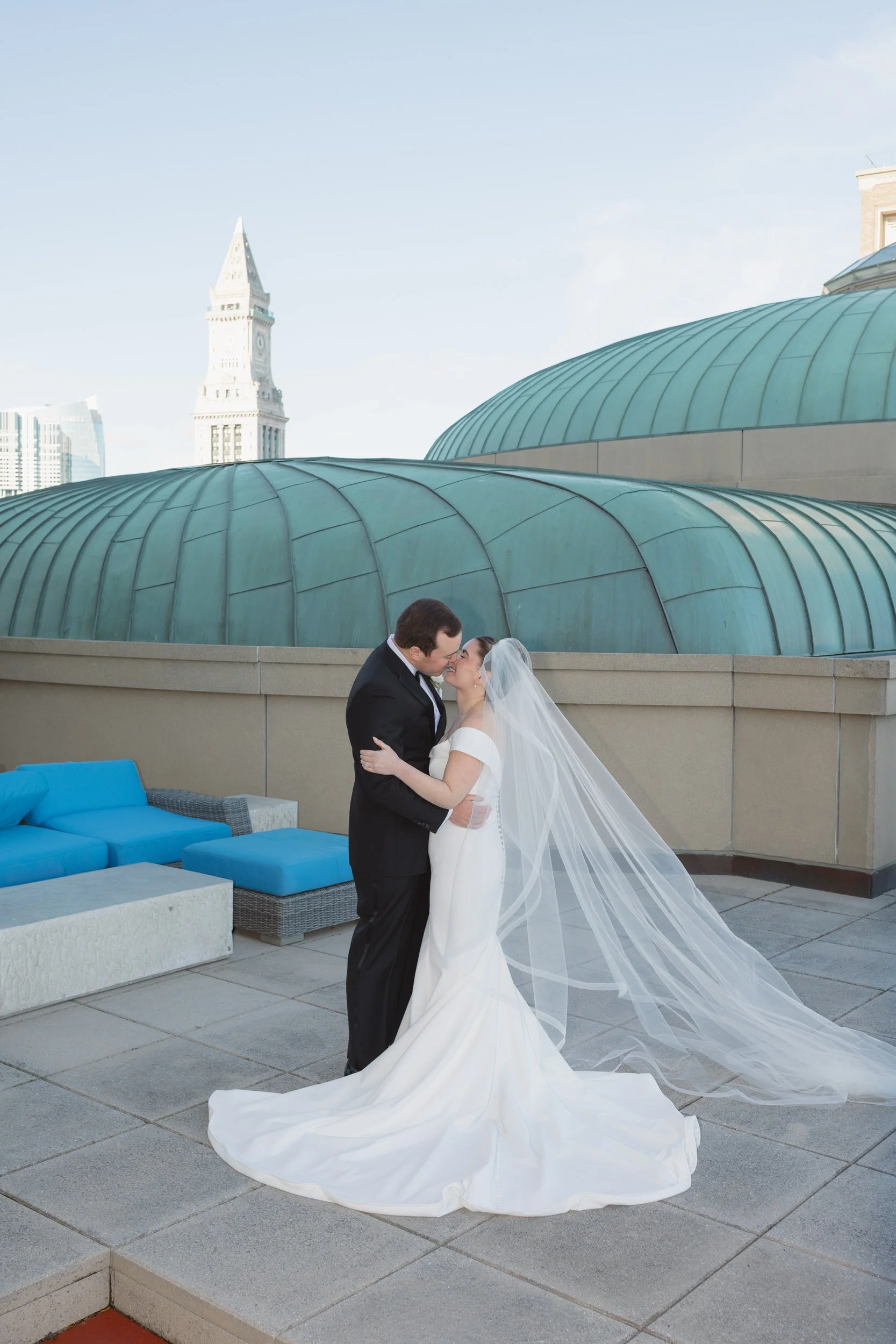 Emotional rooftop portraits during private vows at the Boston Harbor Hotel