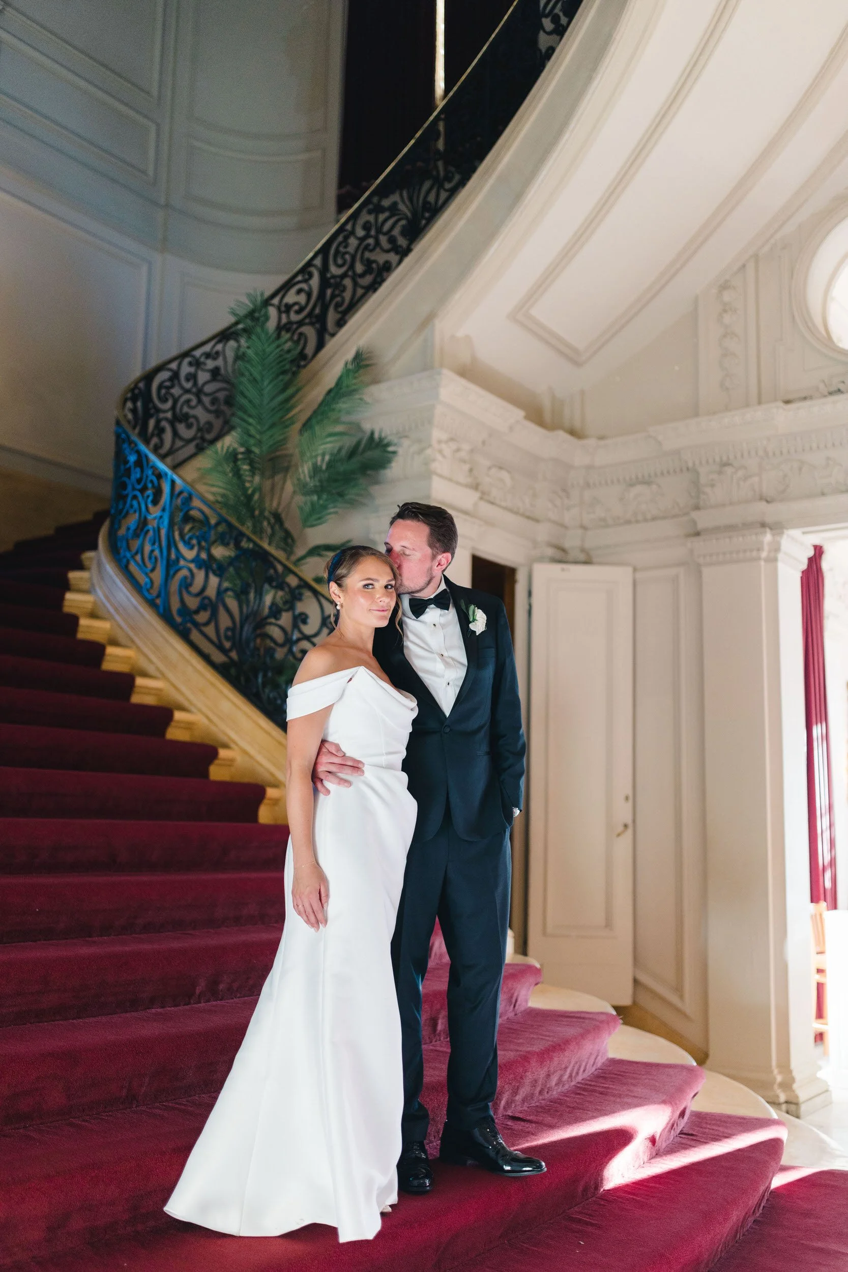 Bride and groom on the famous Rosecliff stairs in Newport, RI
