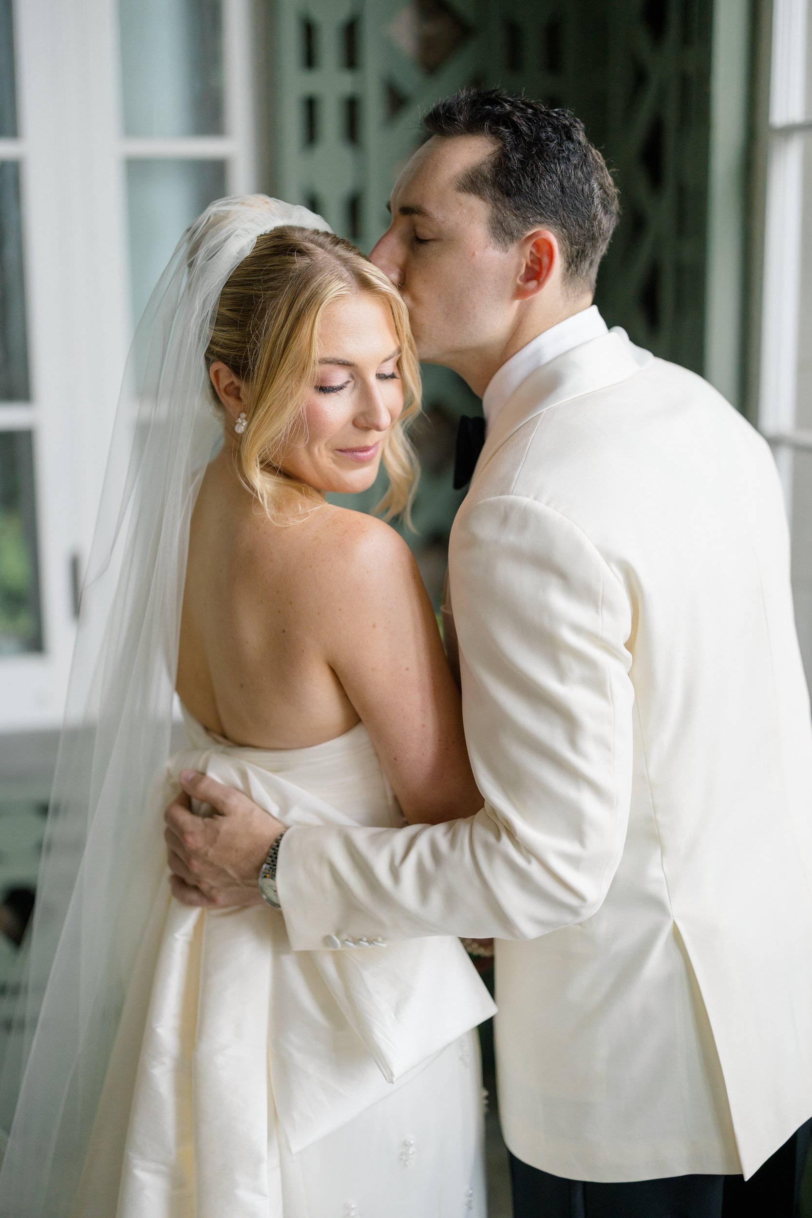 Romantic wedding portraits at Blithewold Mansion featuring lush gardens and historic interiors.