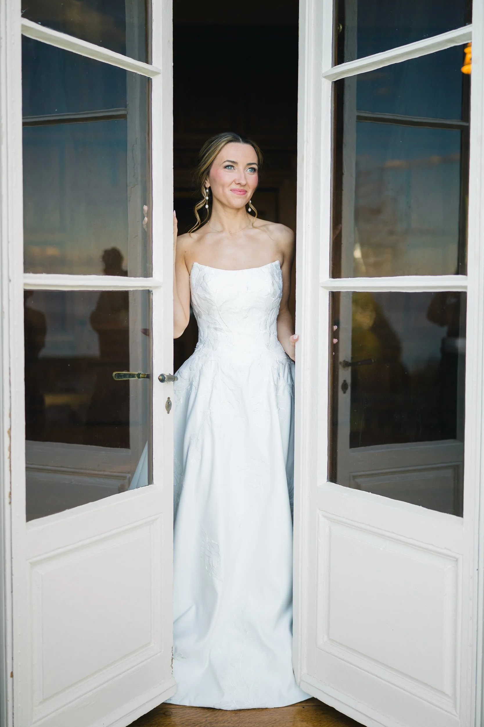 Bride in modern wedding gown photographed inside historic coastal estate