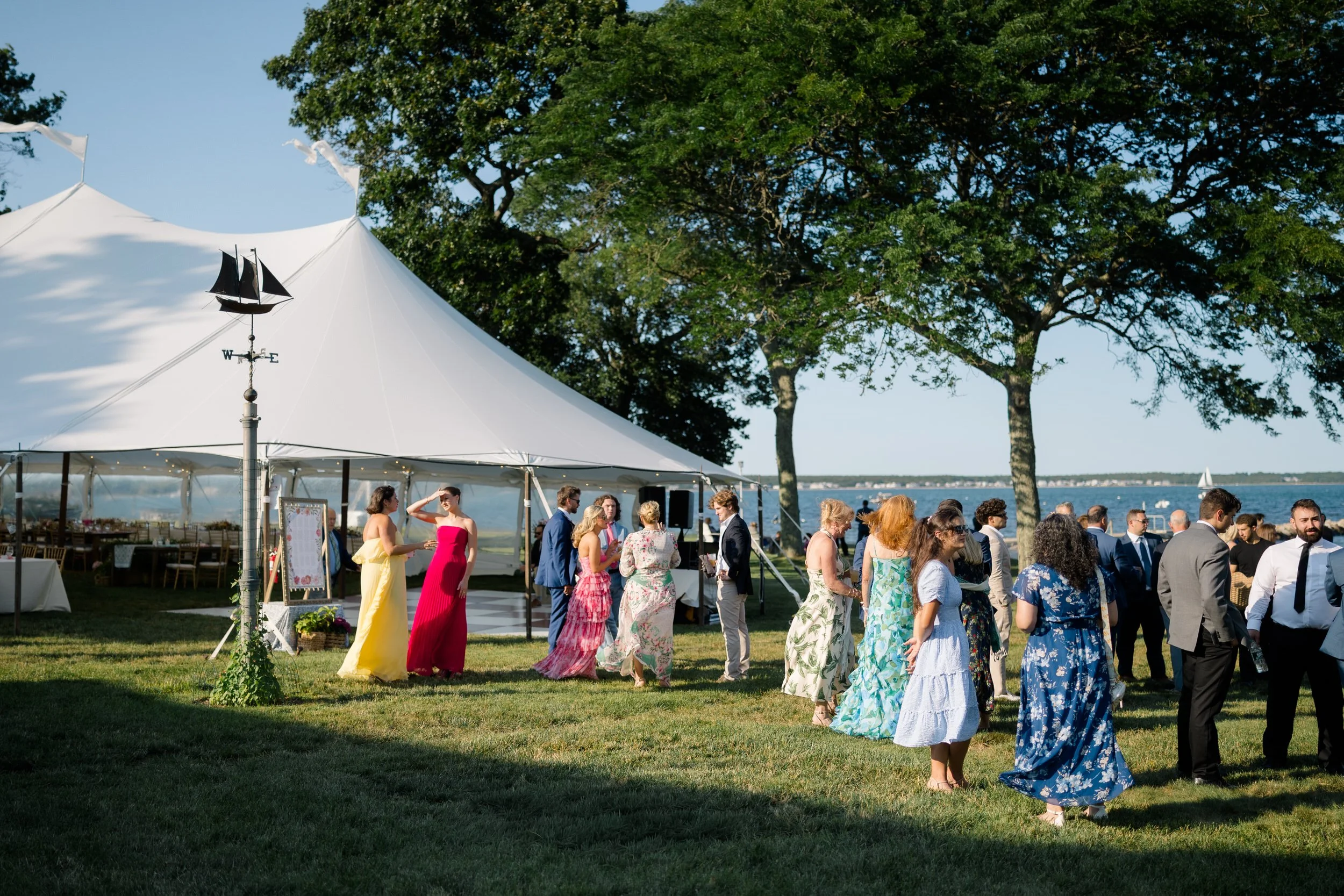 Guests mingling during cocktail hour at a Cape Cod private estate wedding.