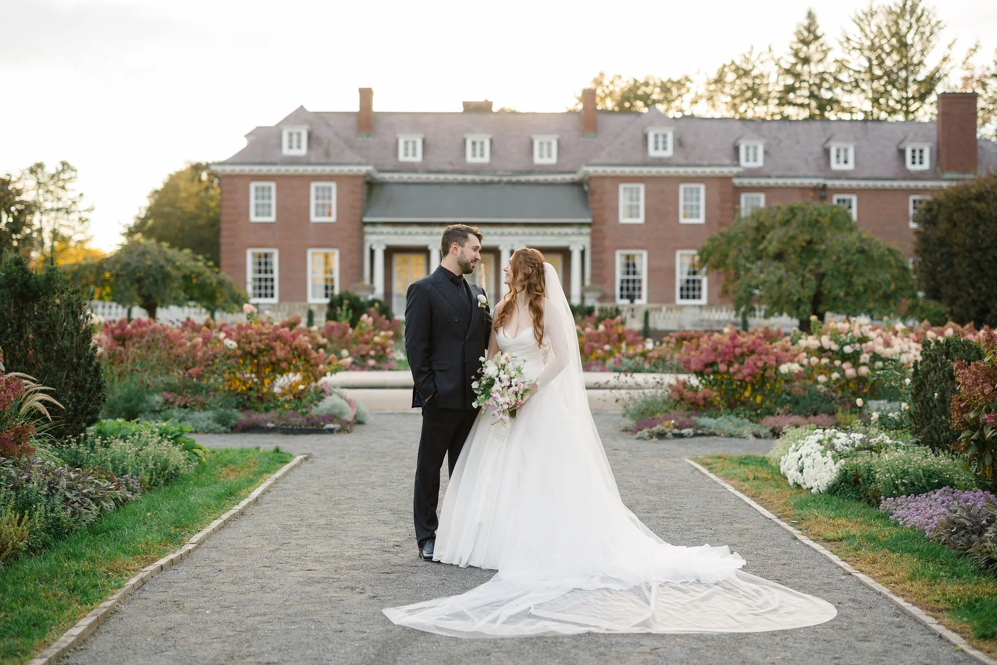 Wedding couple portraits at Elm Bank in Wellesley, Massachusetts, among the venue's garden scenery.