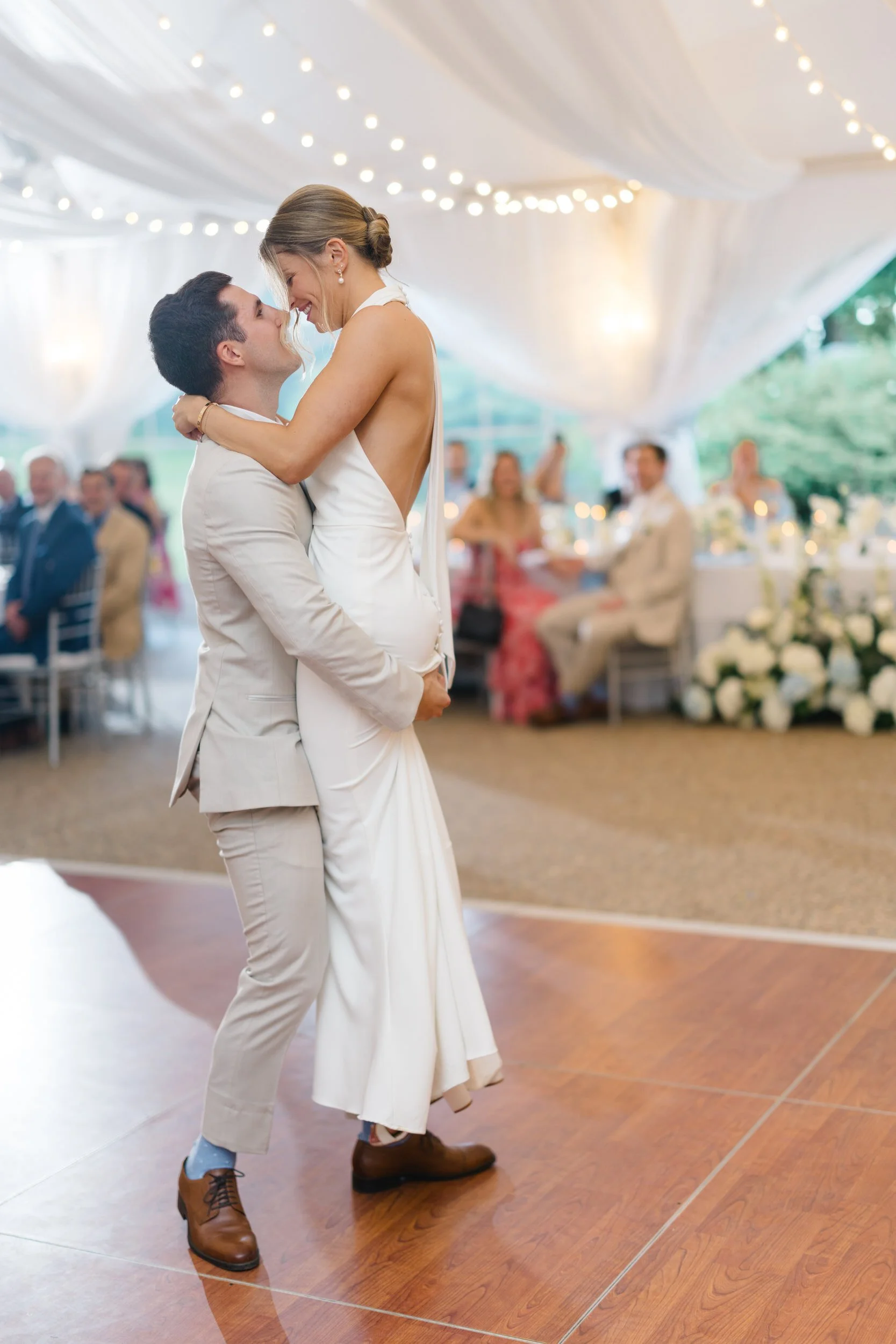 Newlyweds celebrating with family and friends during their reception.