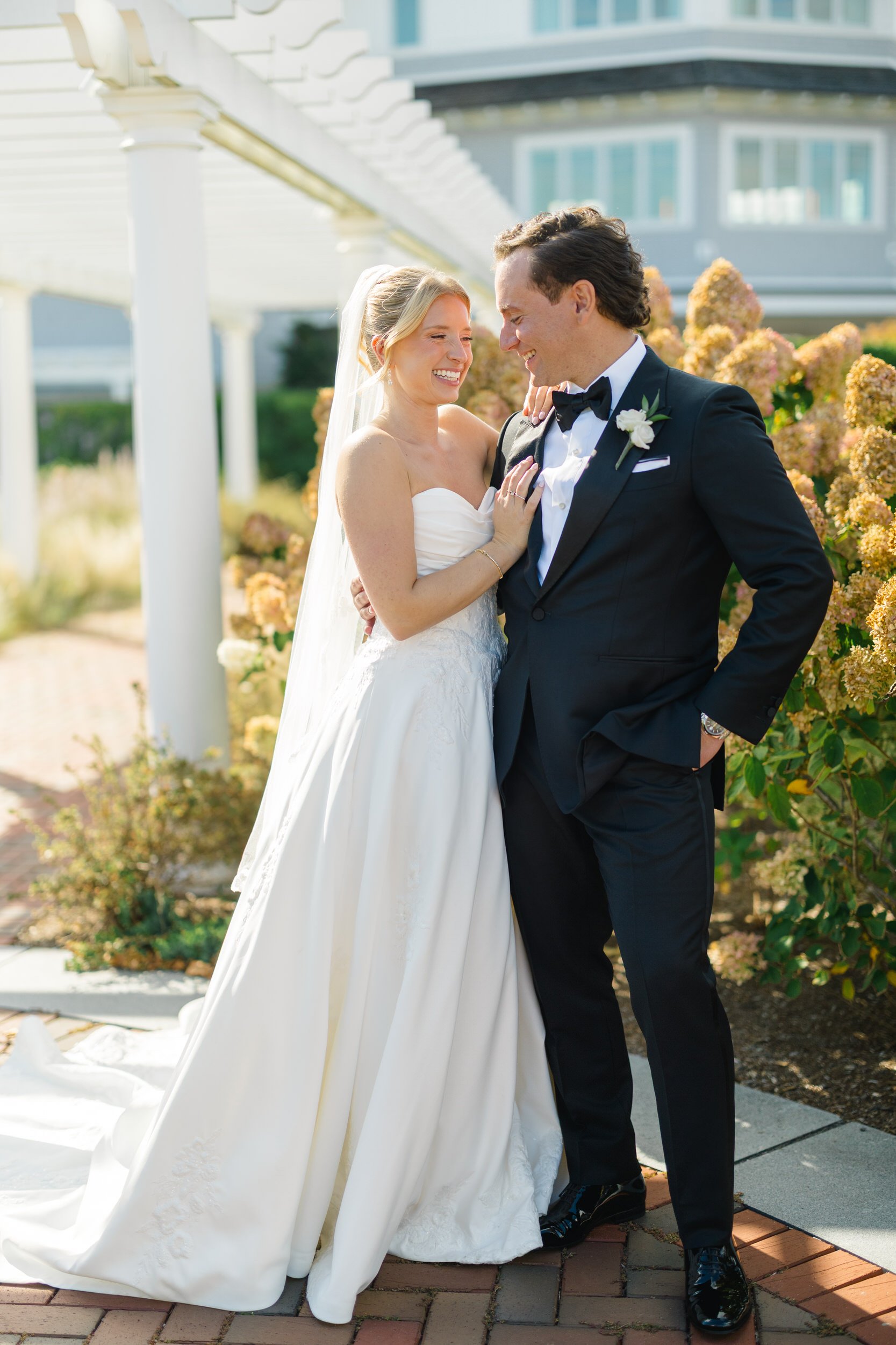 Newlyweds photographed at Dune during their fall wedding at Wychmere Beach Club.
