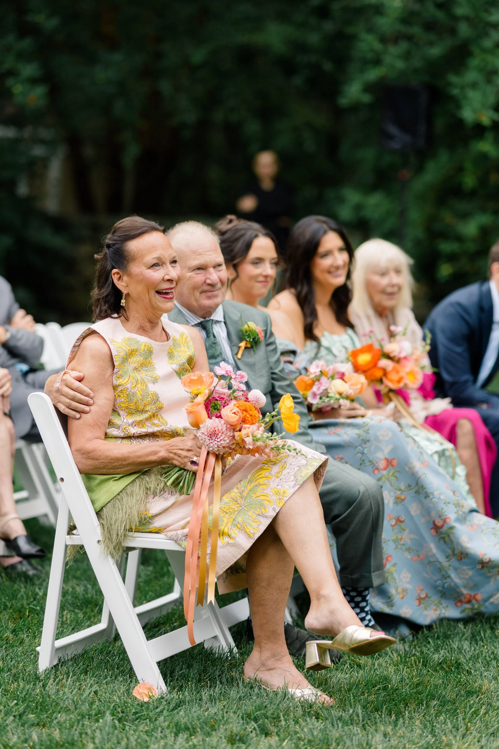 Romantic garden ceremony filled with colorful seasonal flowers at the Connors Center.