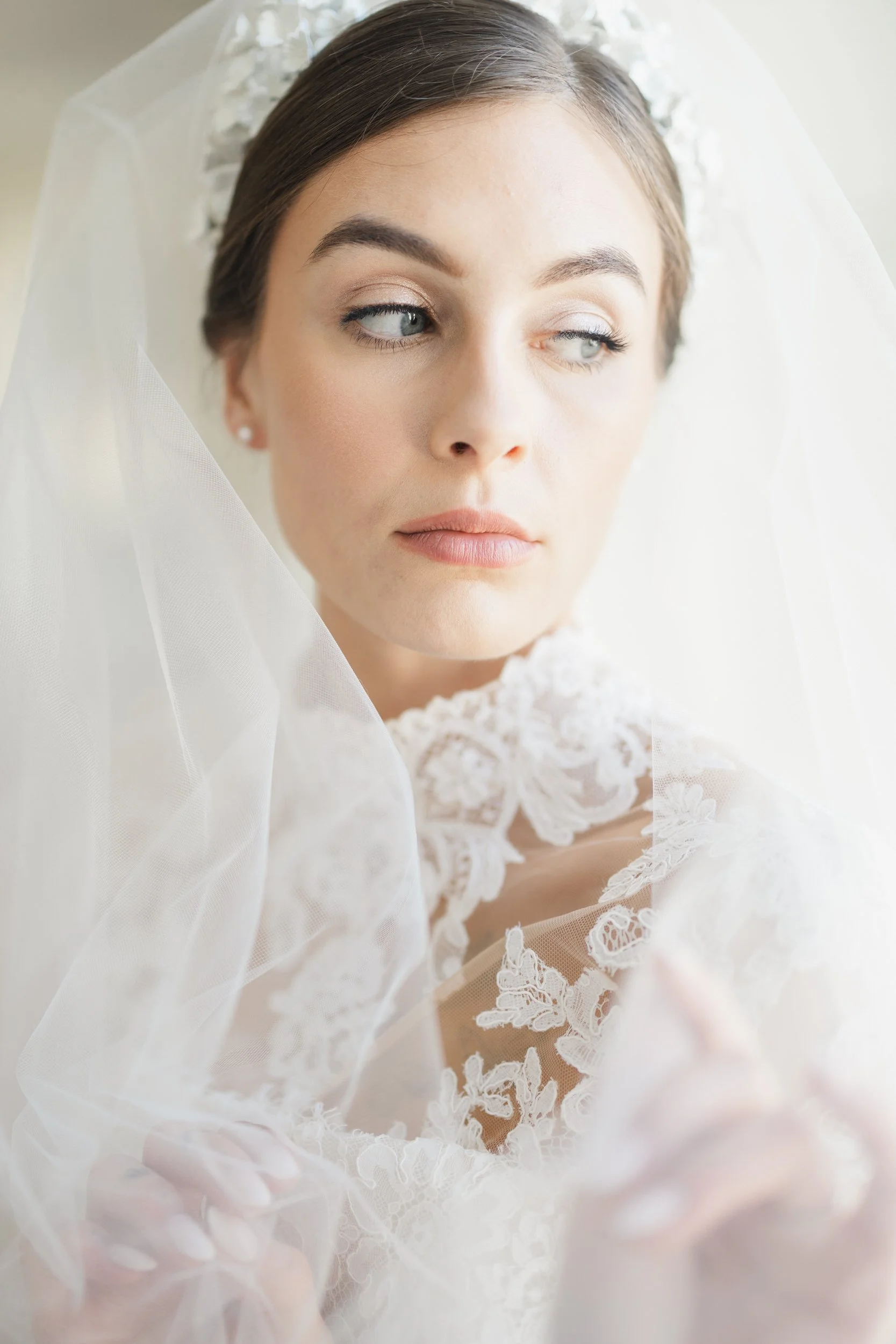 Bridal portrait with neutral florals and warm interior light at Brasserie La Banque in downtown Charleston, SC