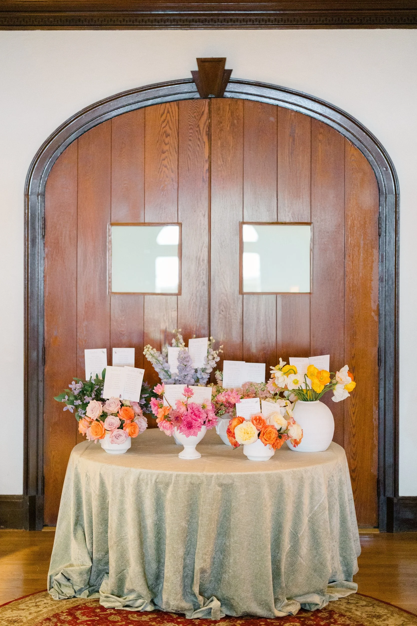 Colorful cocktail hour details featuring vibrant seasonal florals at the Connors Center.