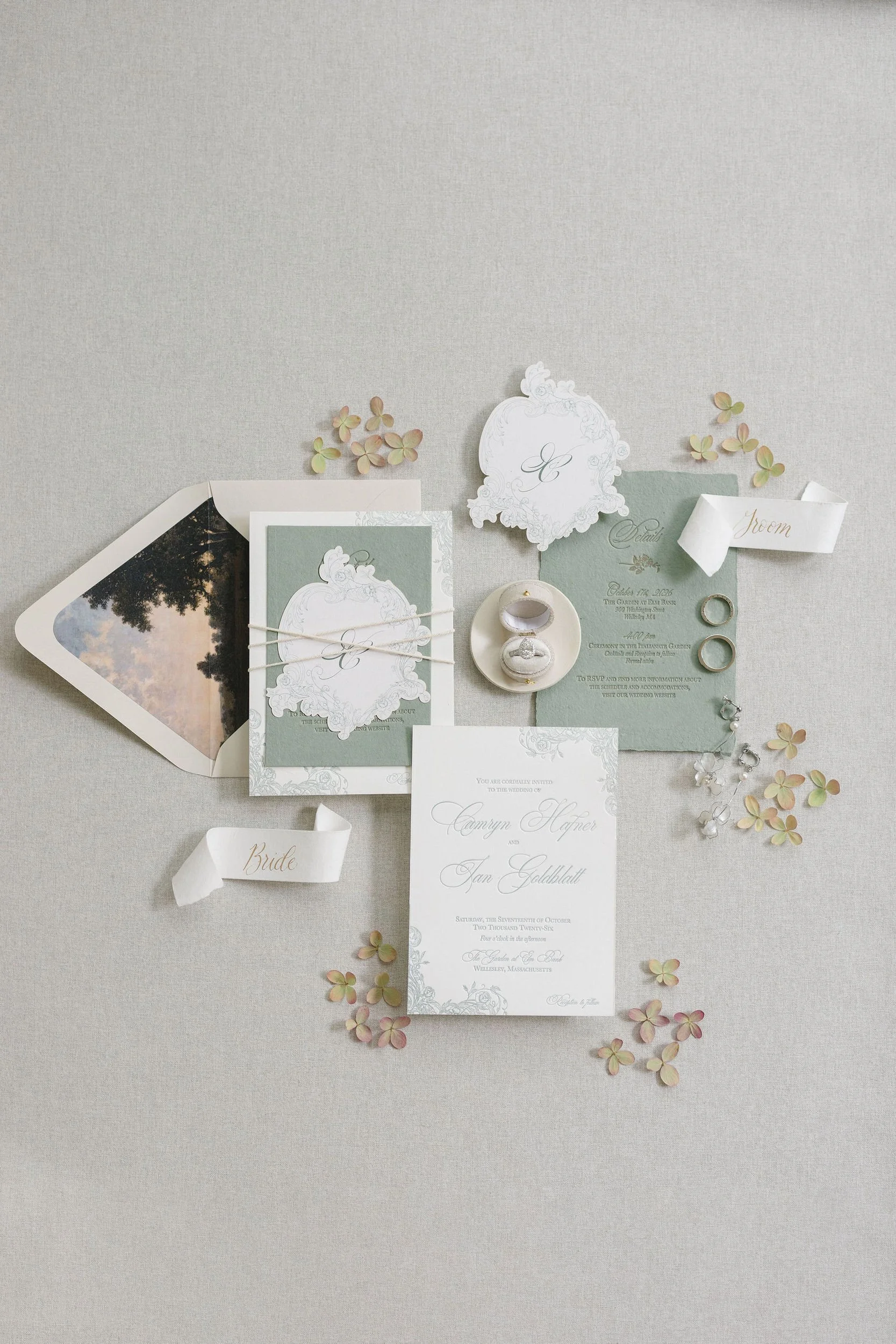 Wedding day details arranged in a romantic flat lay inspired by a secret garden wedding at Elm Bank.