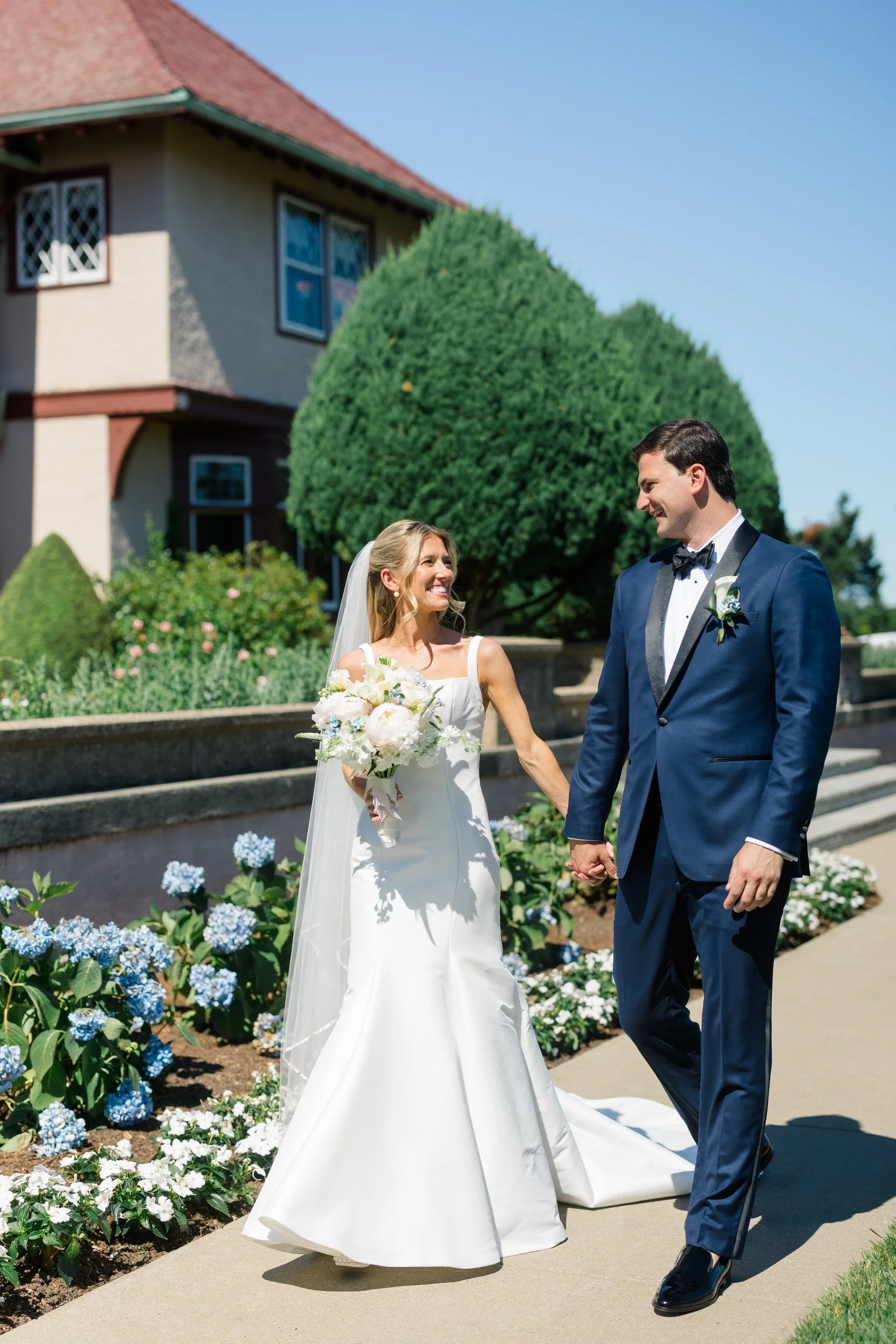 Newlyweds walking together at Ocean Edge Resort in Cape Cod