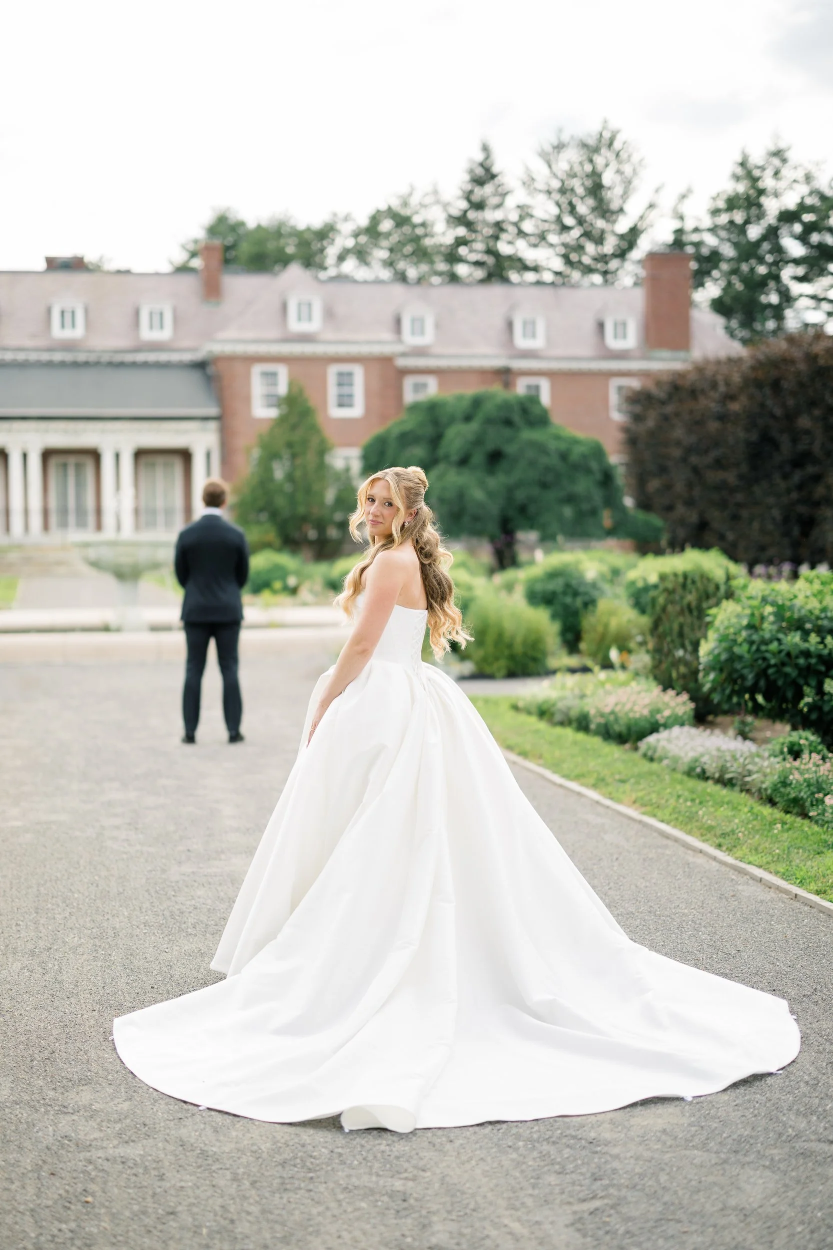 Bride and groom sharing their first look in the Italian Gardens at Elm Bank