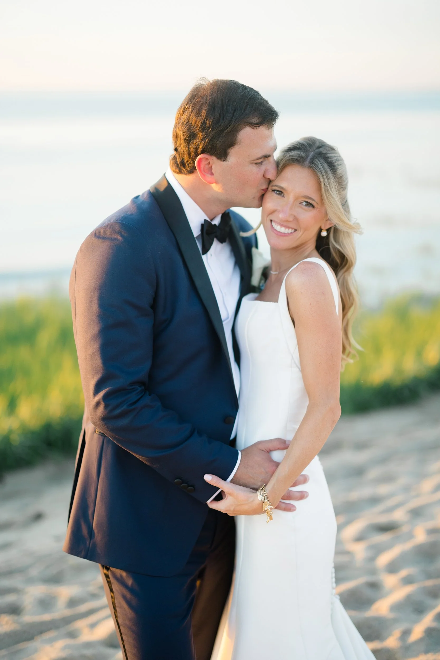 Sunset wedding portraits on the beach at Ocean Edge Resort