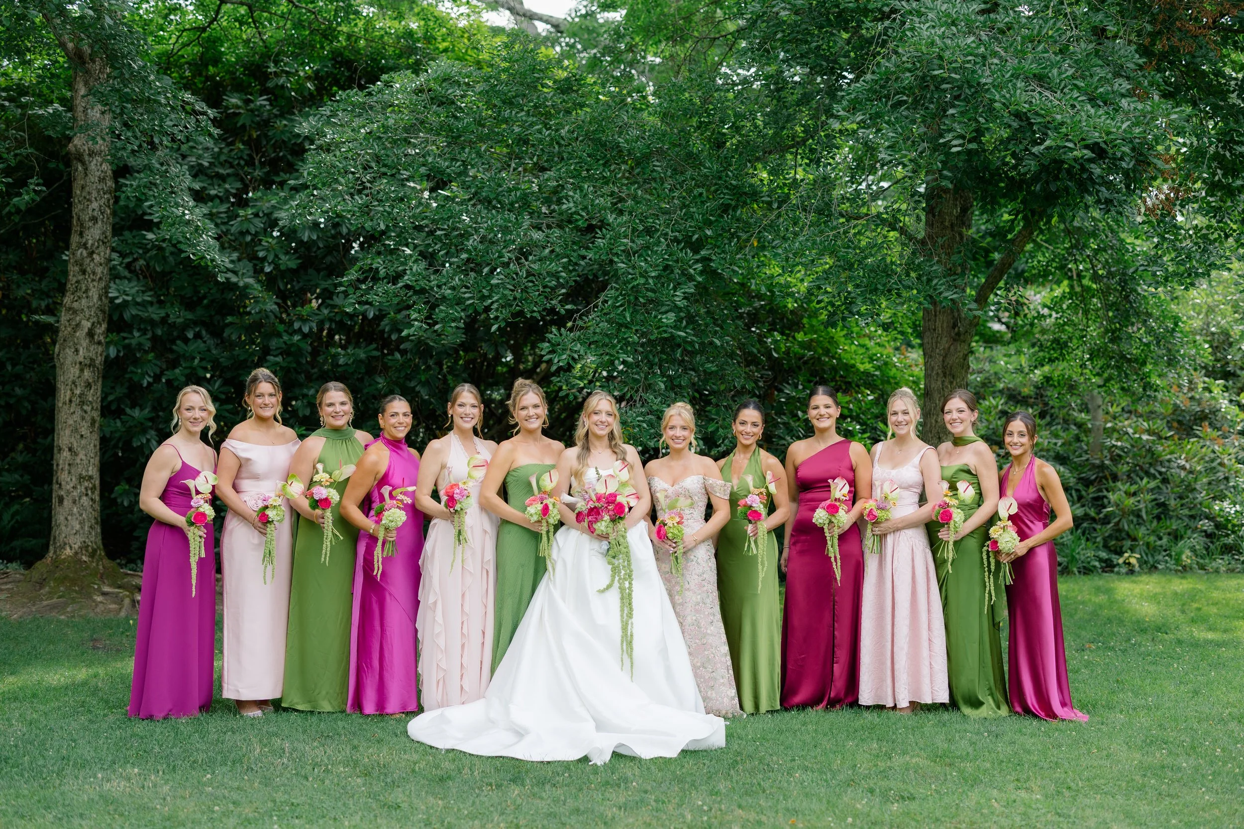 Bridesmaids wearing pink and green dresses at an Elm Bank wedding