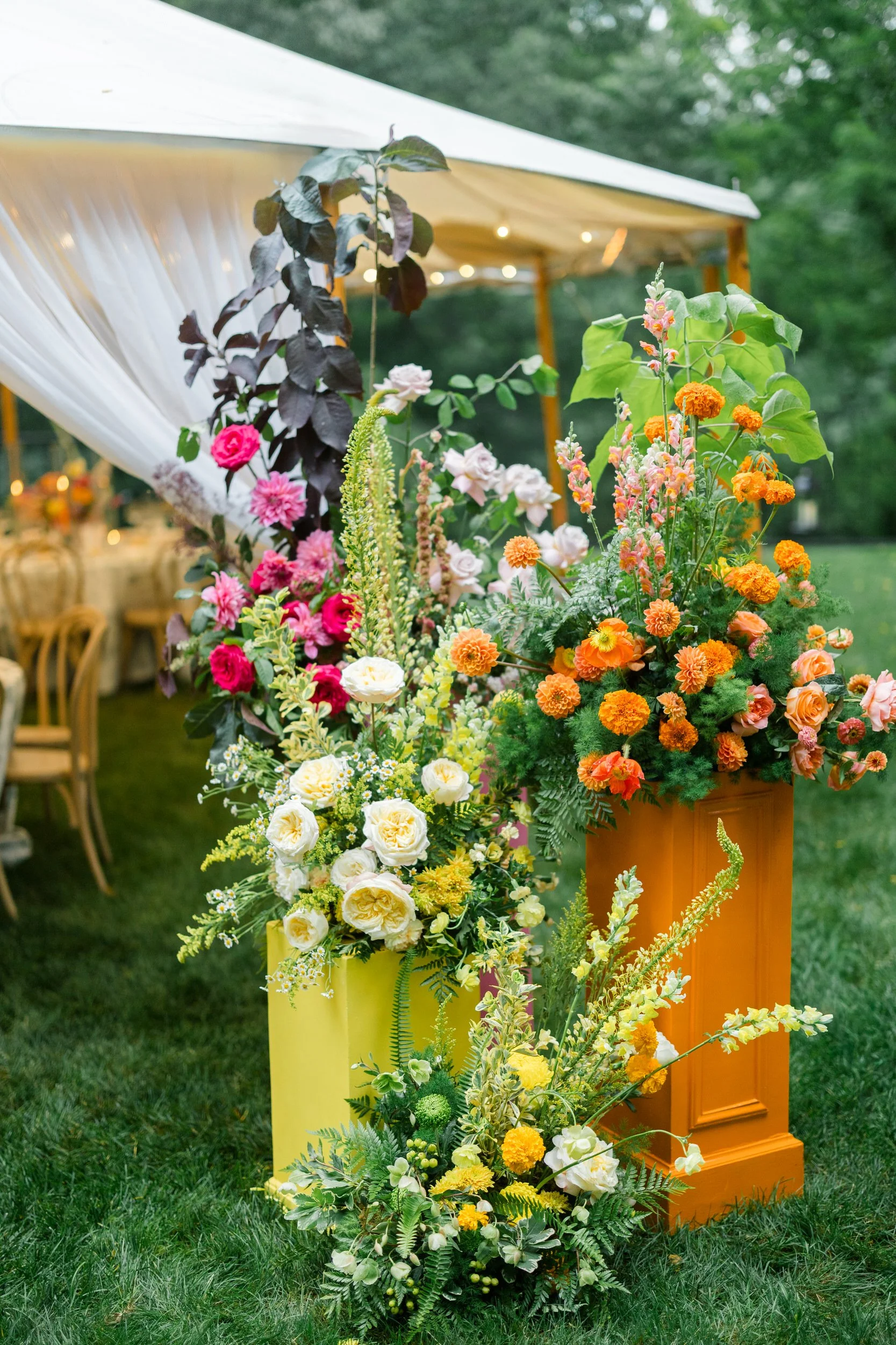Colorful Connors Center reception featuring vibrant floral installations and whimsical garden-inspired details.