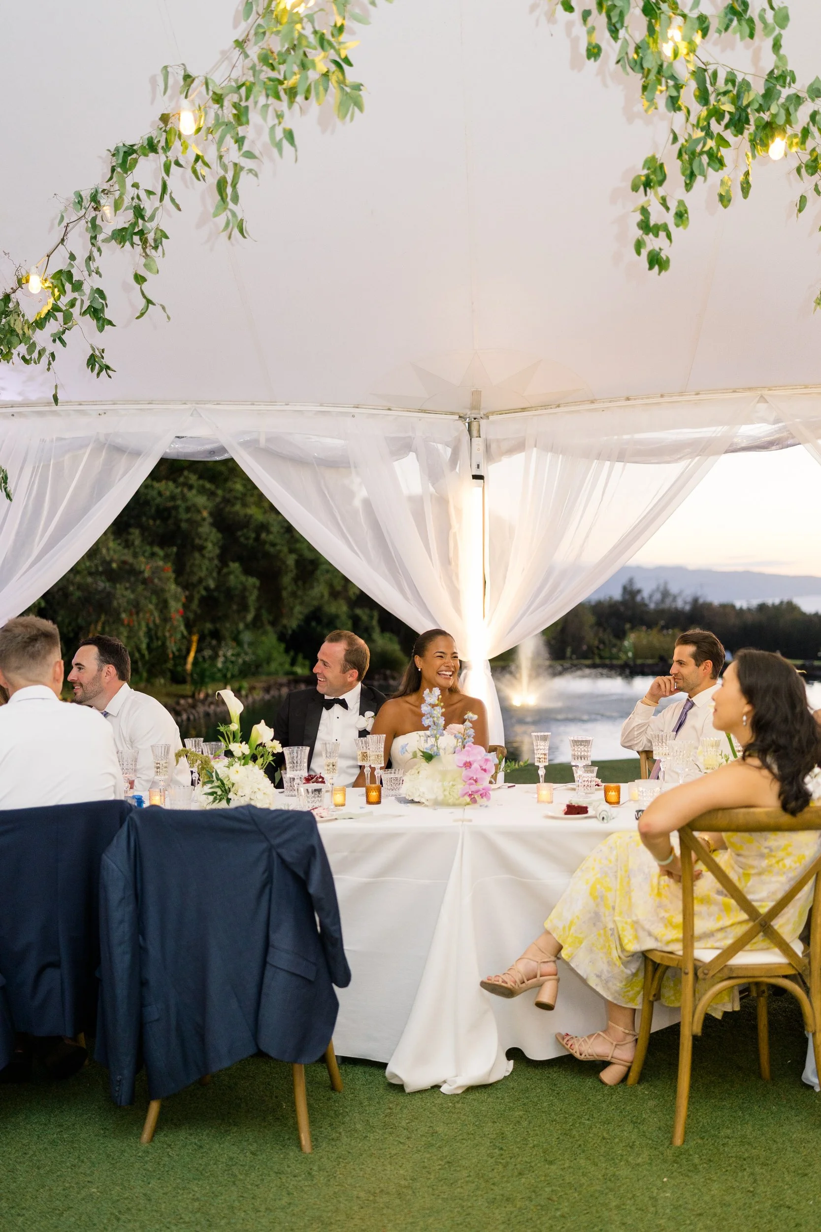 guests enjoying dinner and speeches during hawaii wedding reception
