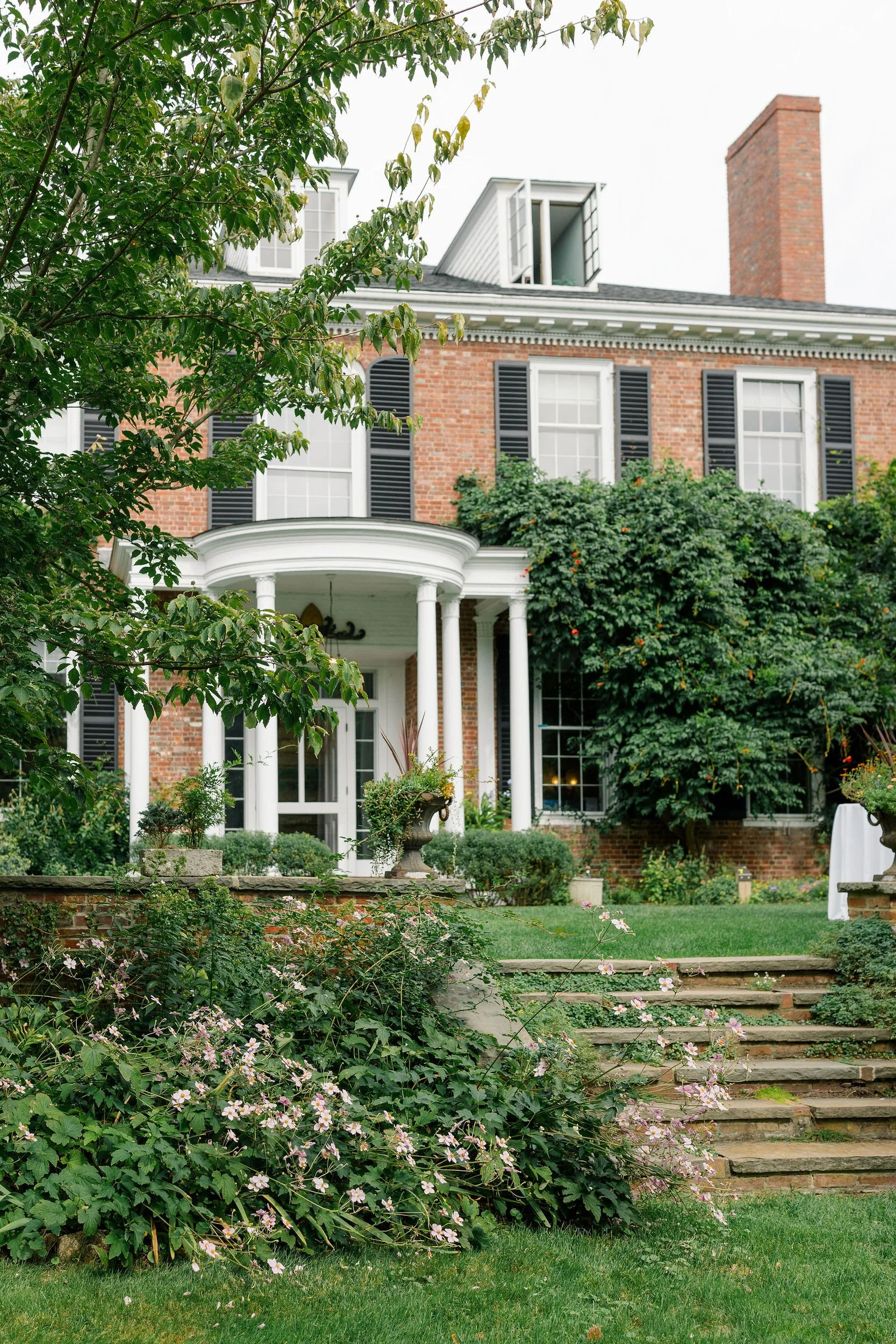 Long Hill wedding venue in Beverly, Massachusetts, surrounded by landscaped gardens and mature trees.