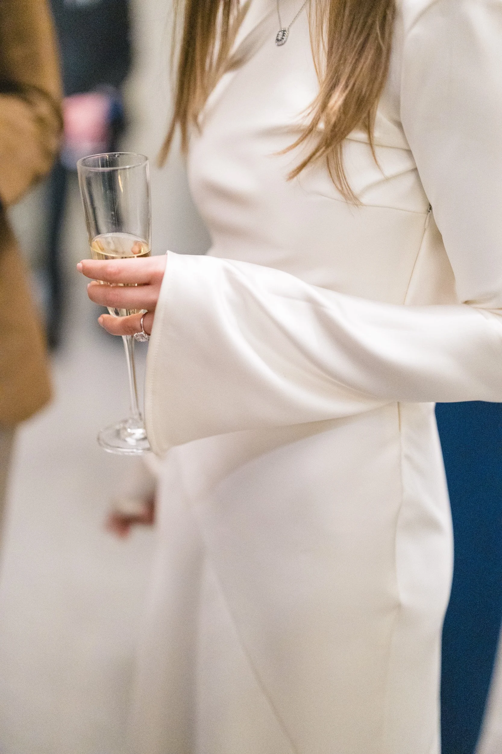 Guests mingling during a rehearsal dinner at the Boston Athenaeum in Beacon Hill.