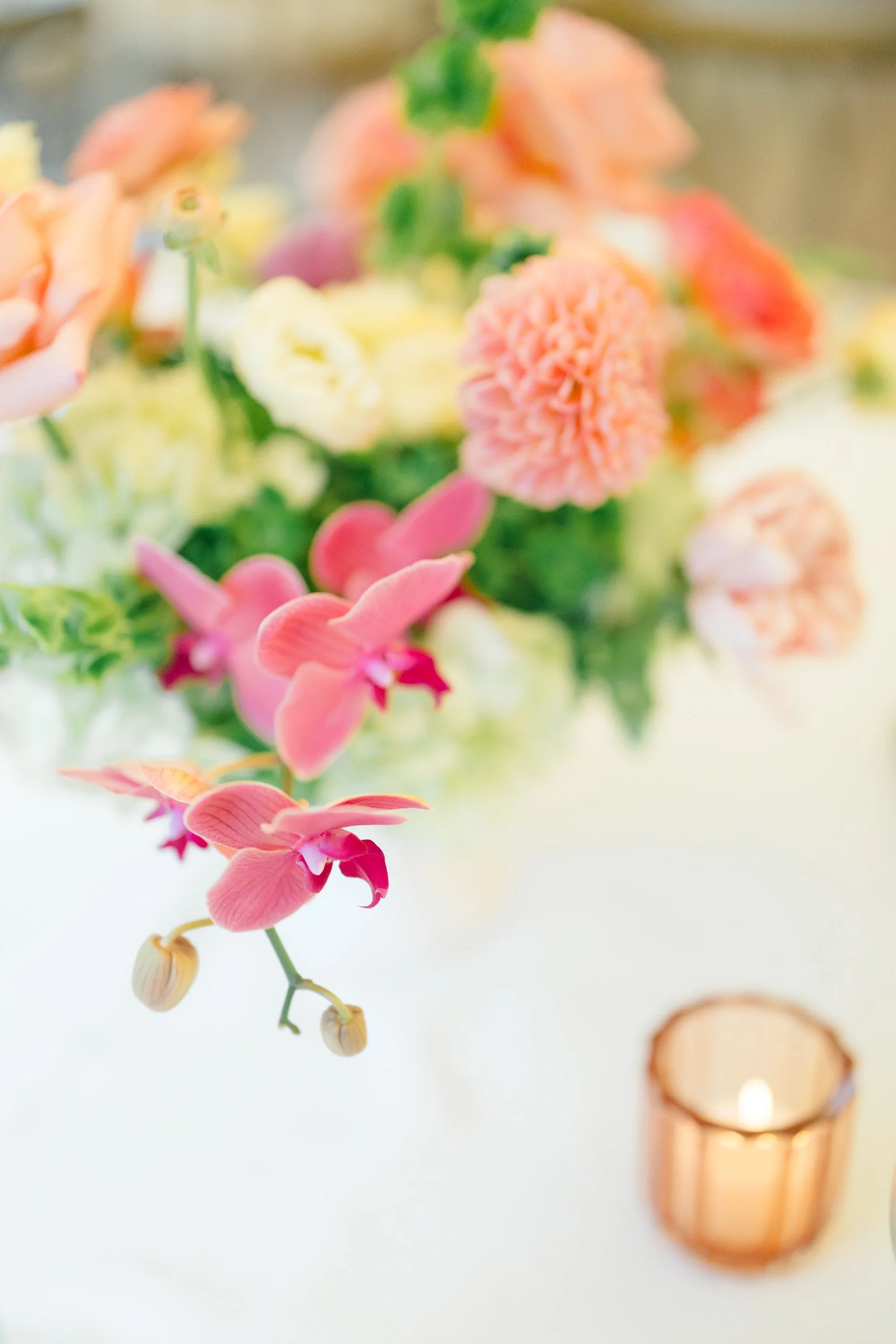 Elegant estate wedding reception details featuring lush garden inspired centerpieces