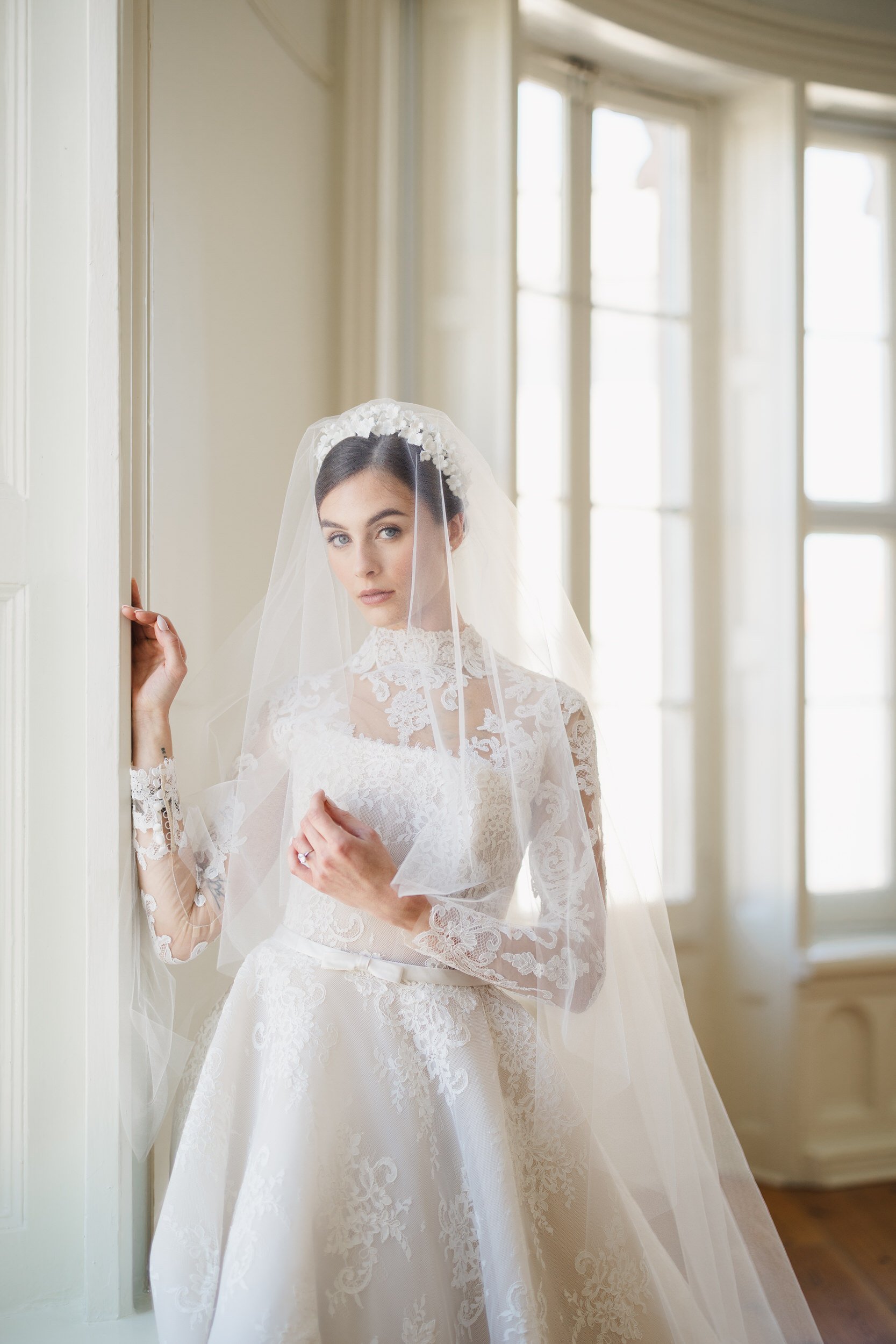 Chic bridal portrait with soft natural light inside Brasserie La Banque, Charleston, South Carolina, photographed by a Charleston wedding photographer