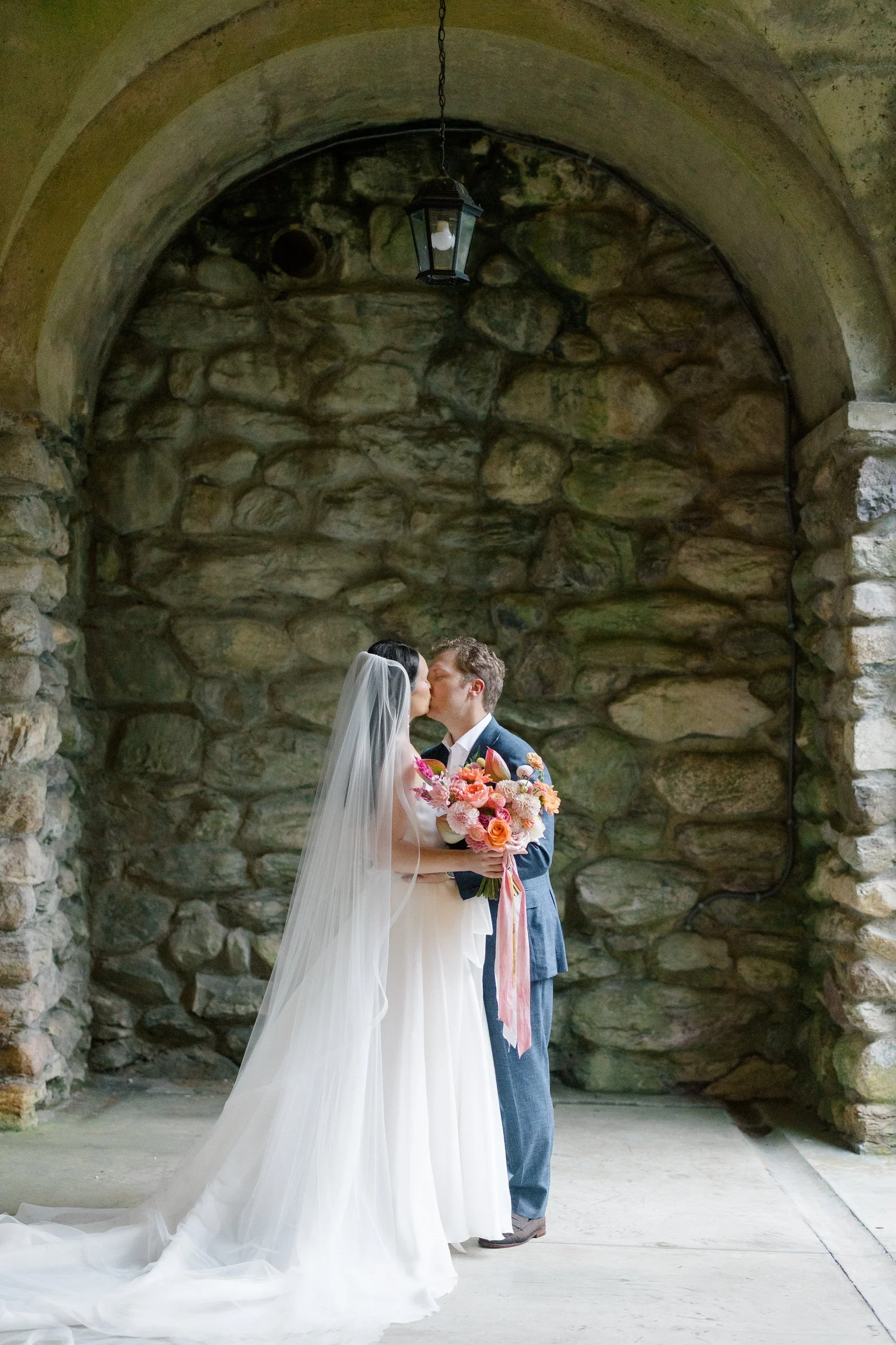 Whimsical bride and groom portraits filled with vibrant garden-inspired colors.